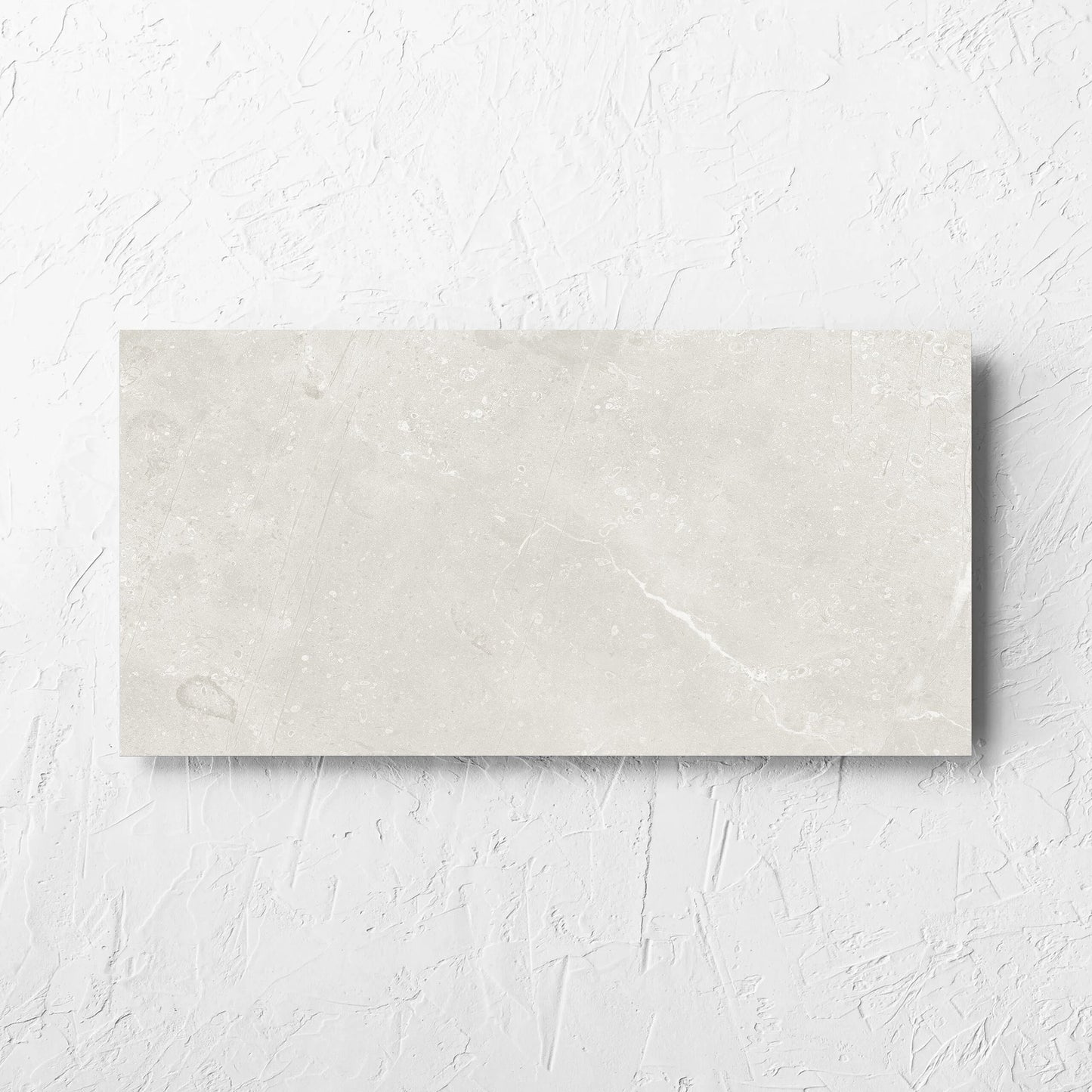 Kashmir Natural Matt 300x600mm tile laid flat on a white rendered wall, showing the matt surface