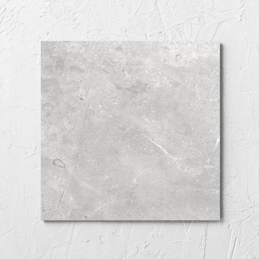 Kashmir Stone Matt 300x300mm tile laid flat on a white rendered wall, showing the matt surface
