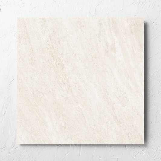 Kora Stone Chalk Matt 600x600mm tile laid flat on a white rendered wall, showing the matt surface