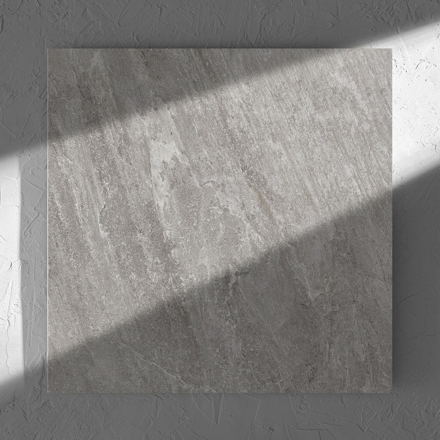 Kora Stone Shale Matt 600x600mm tile in soft natural window light, showing the matt surface