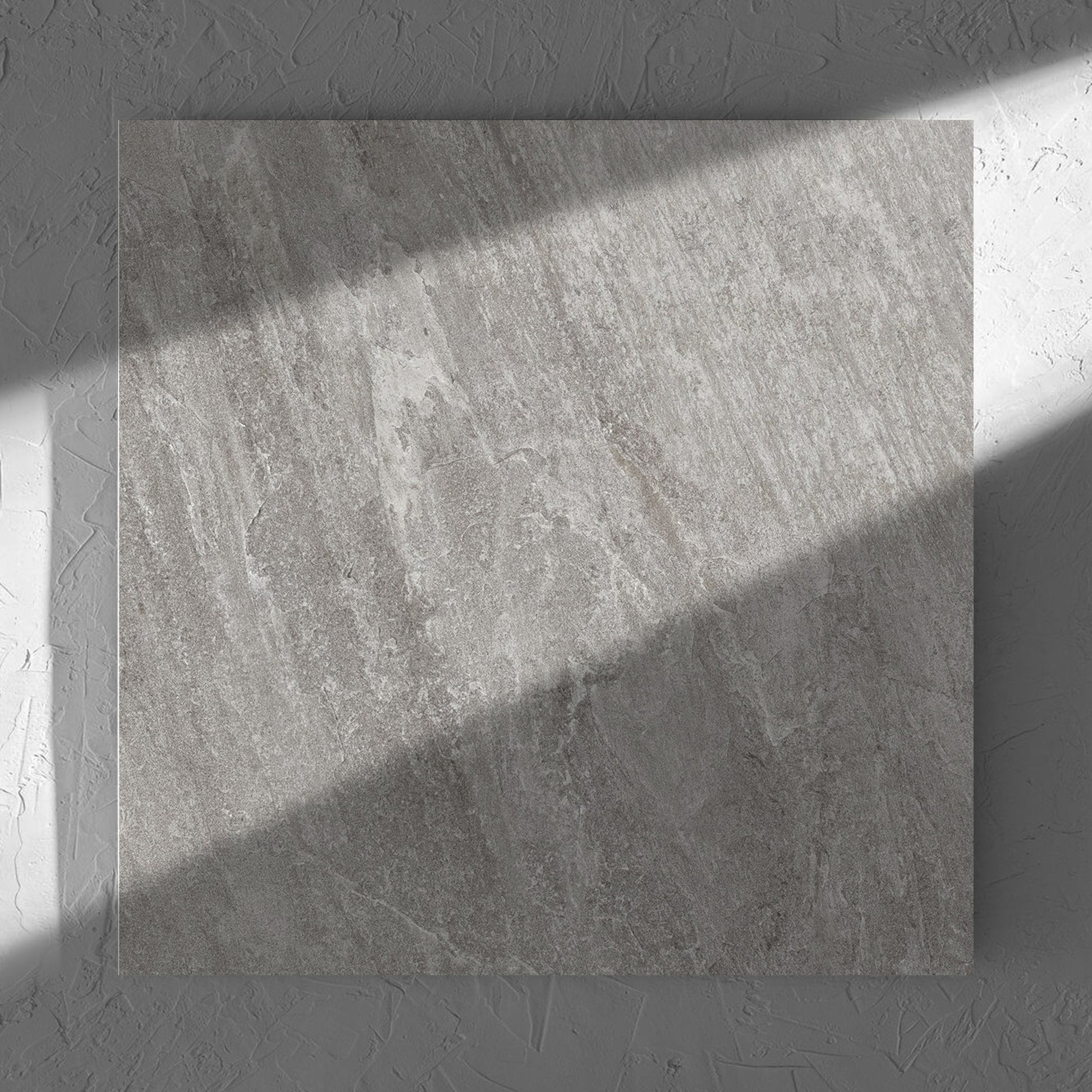 Kora Stone Shale Matt 600x600mm tile in soft natural window light, showing the matt surface