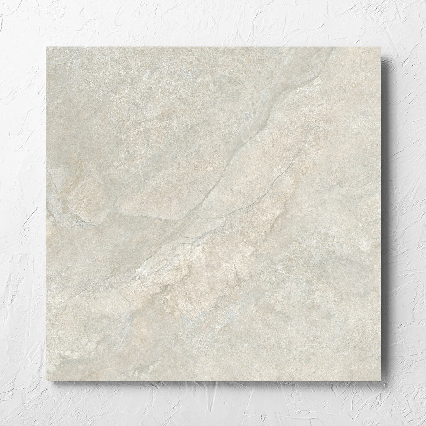 Lakestone Grey Matt 600x600mm tile laid flat on a white rendered wall, showing the matt surface