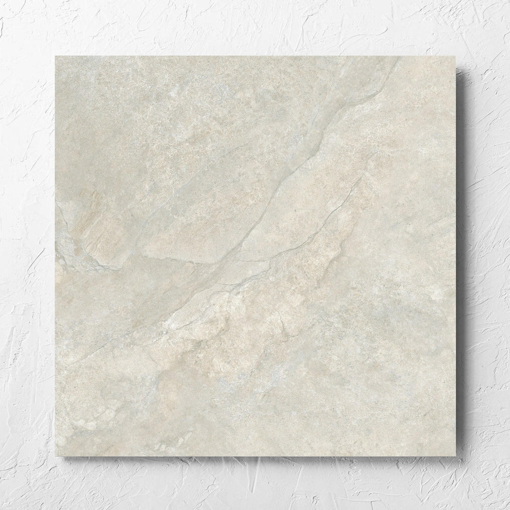 Lakestone Grey Matt 600x600mm tile laid flat on a white rendered wall, showing the matt surface