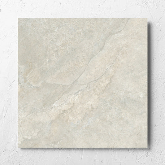 Lakestone Grey Matt 600x600mm tile laid flat on a white rendered wall, showing the matt surface