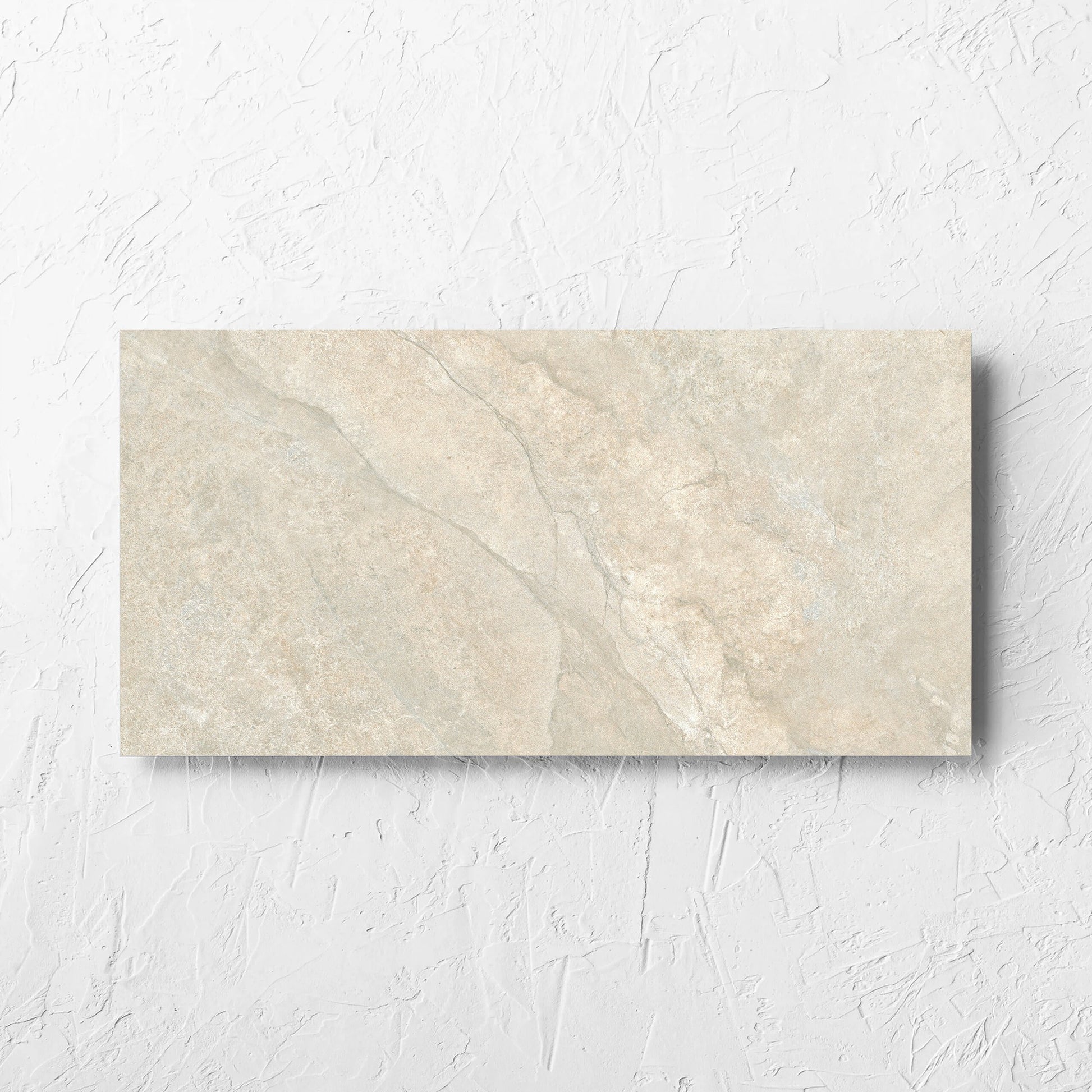 Lakestone Natural Matt 300x600mm tile laid flat on a white rendered wall, showing the matt surface