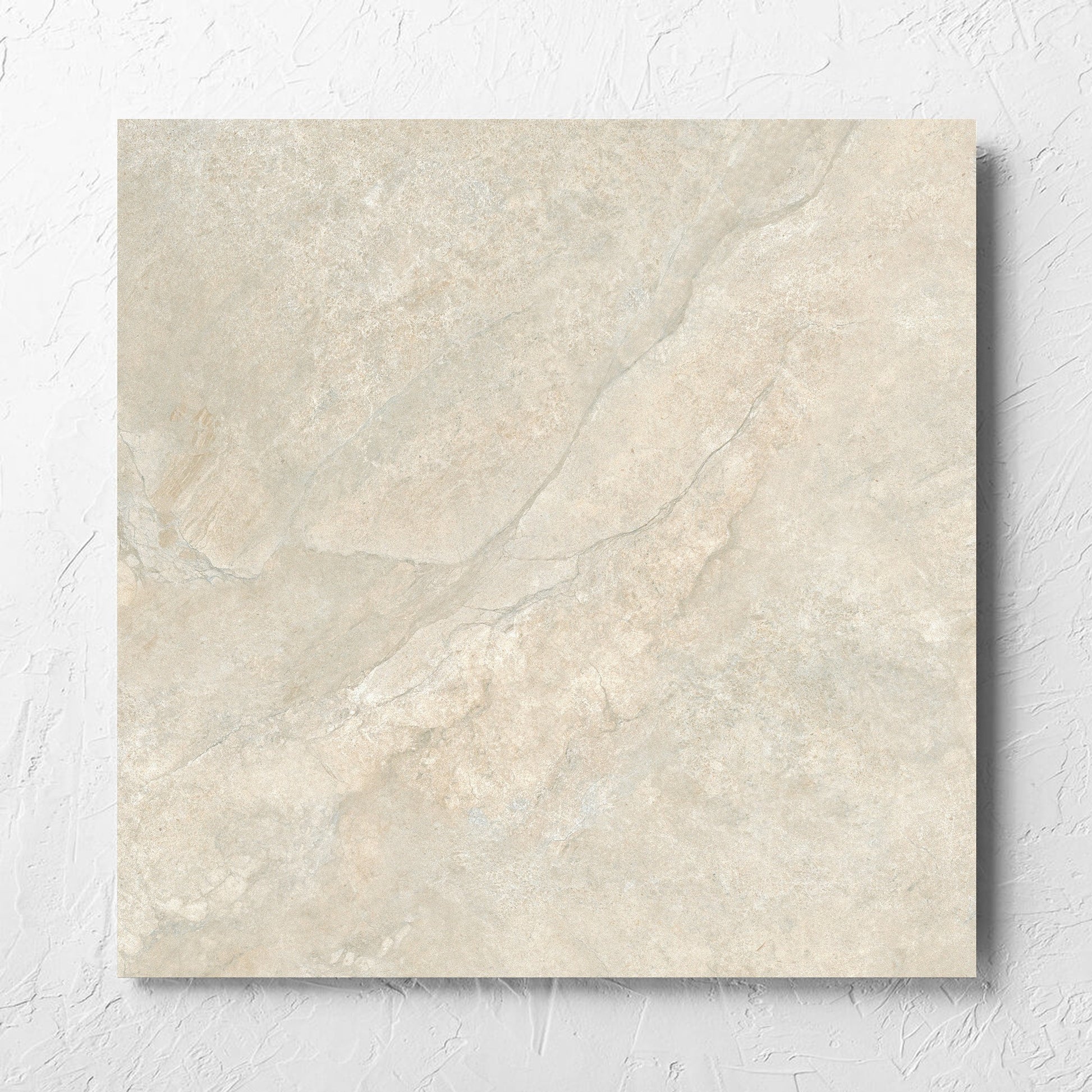 Lakestone Natural Matt 600x600mm tile laid flat on a white rendered wall, showing the matt surface