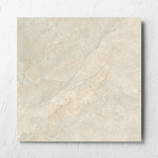 Lakestone Natural Matt 600x600mm tile laid flat on a white rendered wall, showing the matt surface