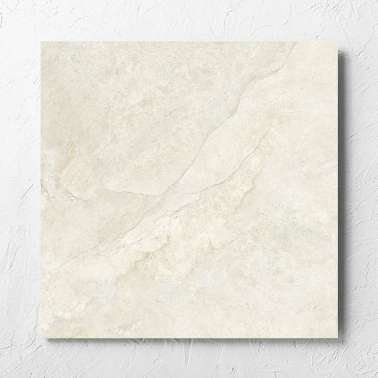 Lakestone Sand Matt 600x600mm tile laid flat on a white rendered wall, showing the matt surface