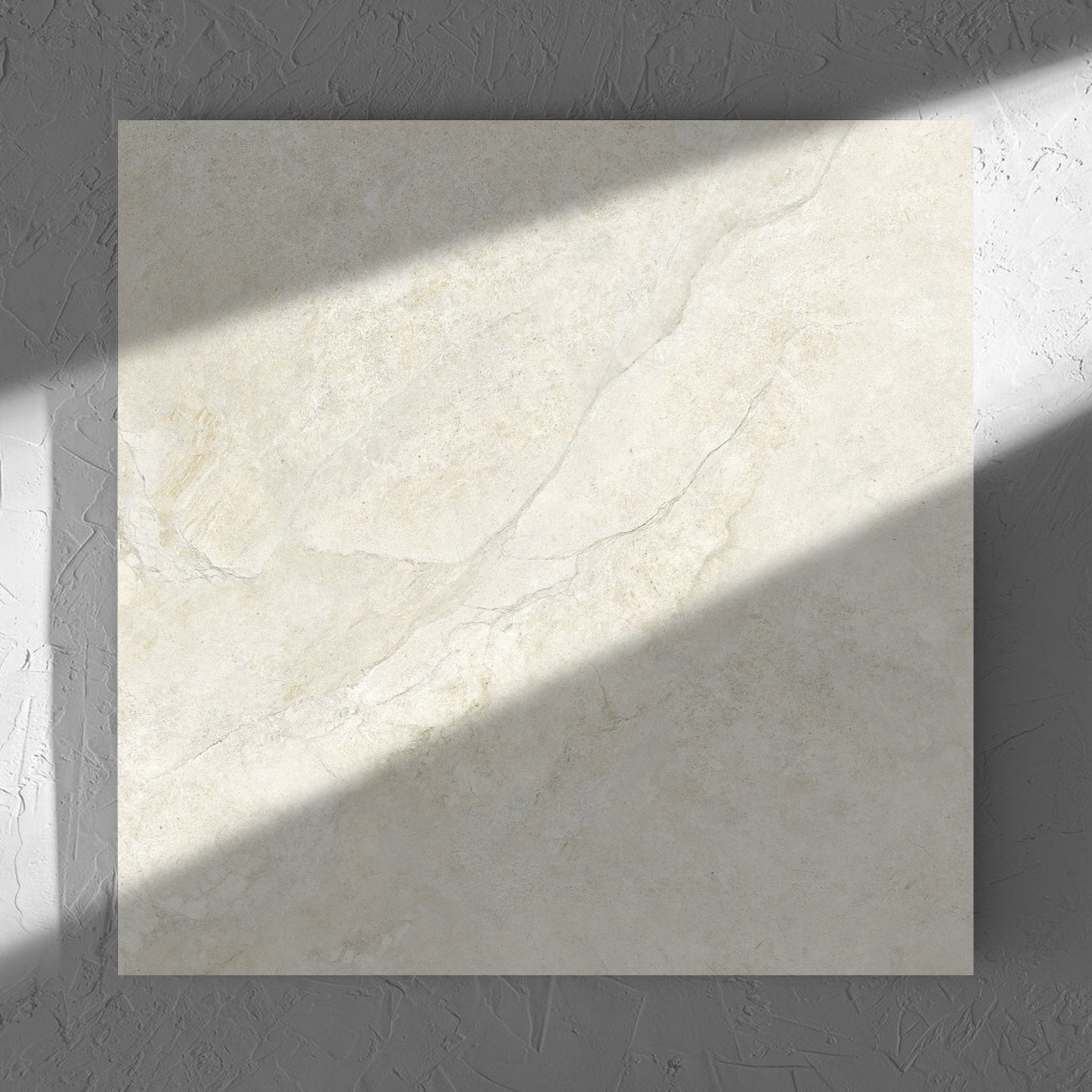 Lakestone Sand Matt 600x600mm tile in soft natural window light, showing the matt surface