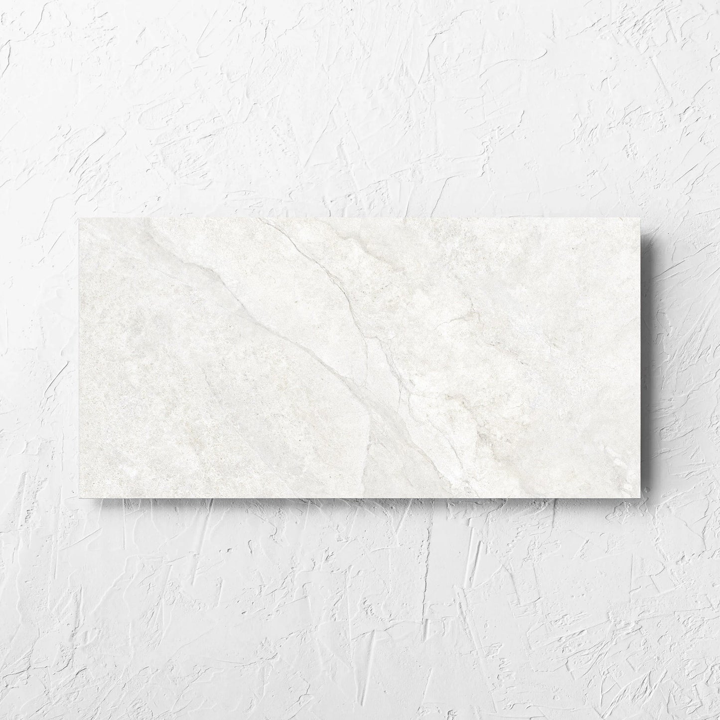 Lakestone White Matt 300x600mm tile laid flat on a white rendered wall, showing the matt surface