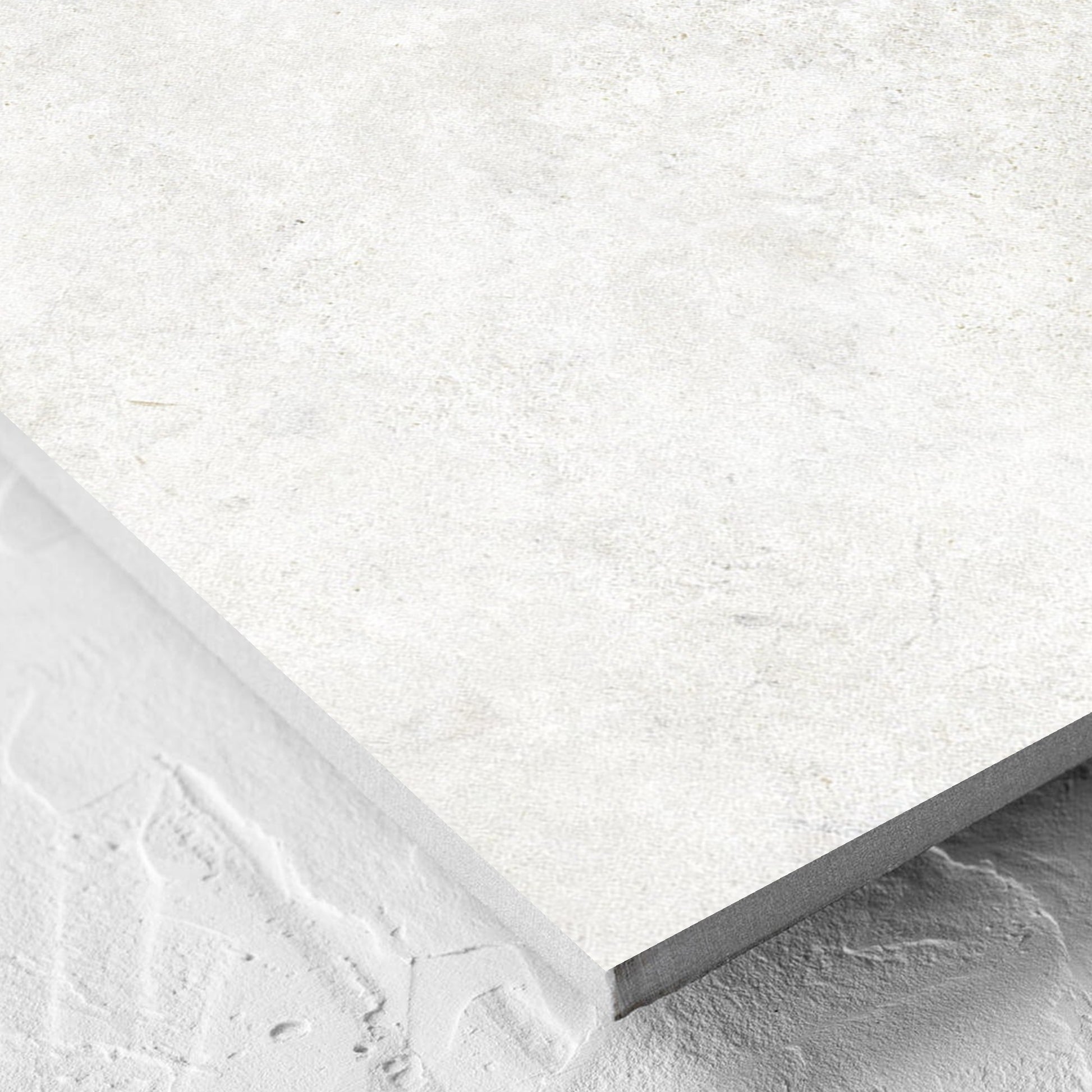 Corner close-up of the Lakestone White Matt 600x600mm tile showing the matt surface and the edge profile