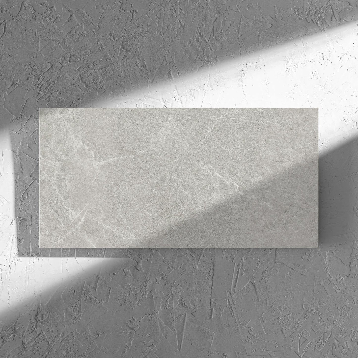 Lava Ash Amber 300x600mm tile in soft natural window light, showing the ash matt surface