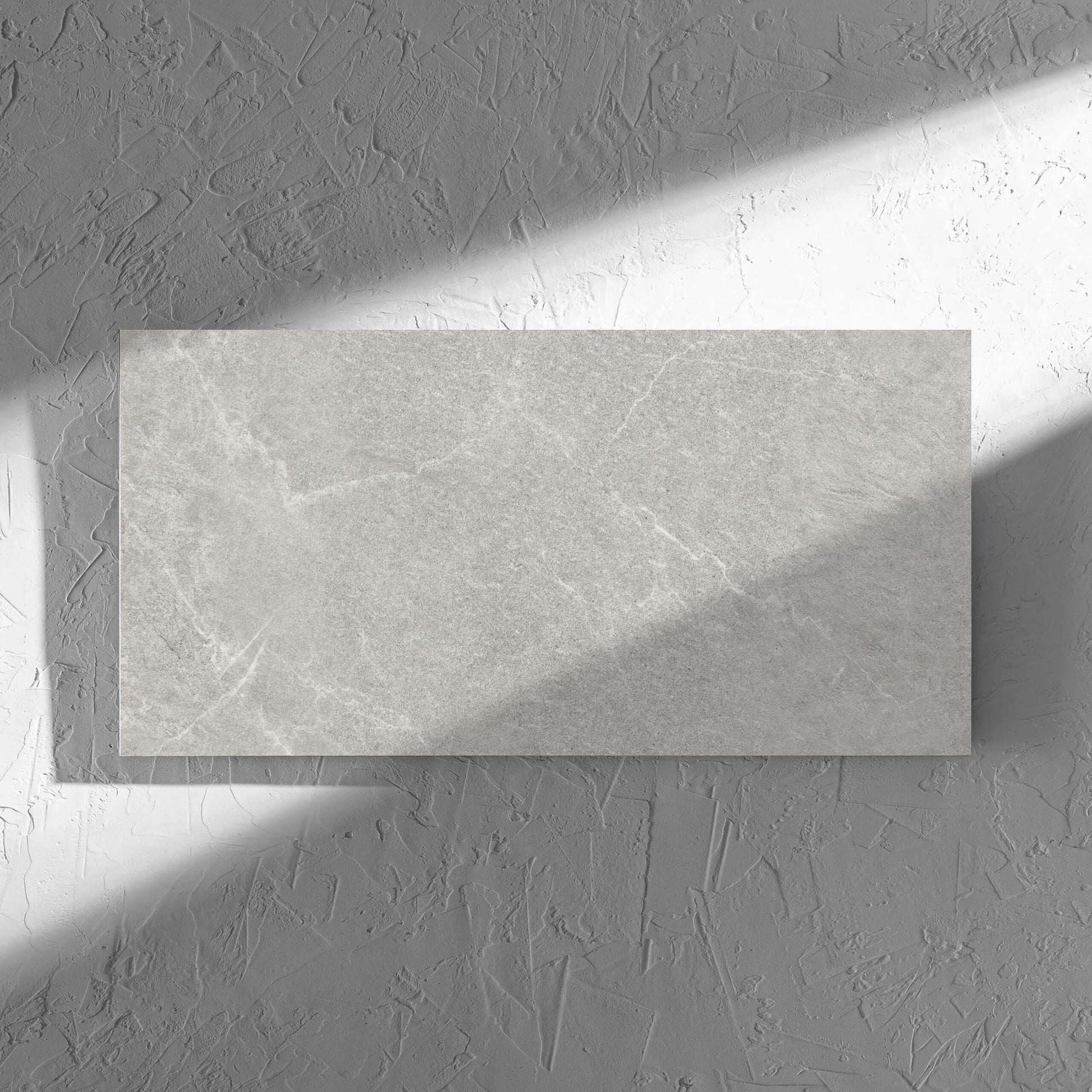 Lava Ash Amber 300x600mm tile in soft natural window light, showing the ash matt surface