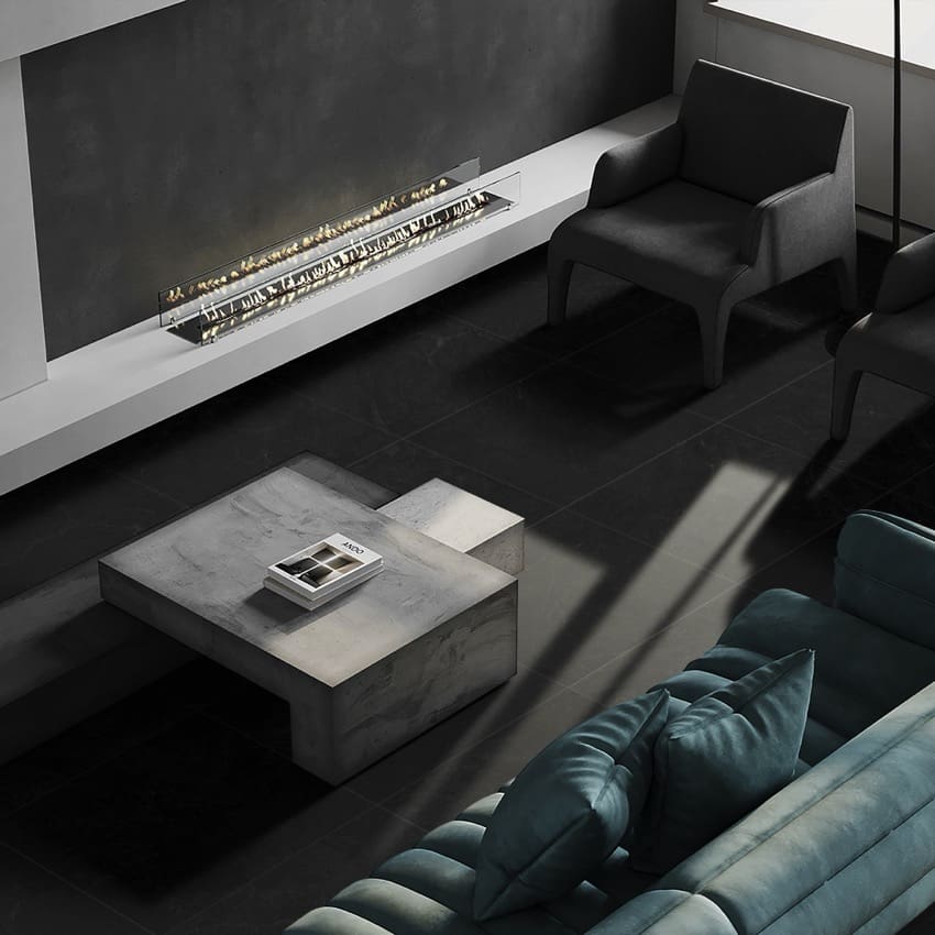 Lava Black Amber 300x600mm porcelain tiles laid across a dramatic living room floor styled with a teal velvet sofa, marble coffee table, and linear wall fireplace.