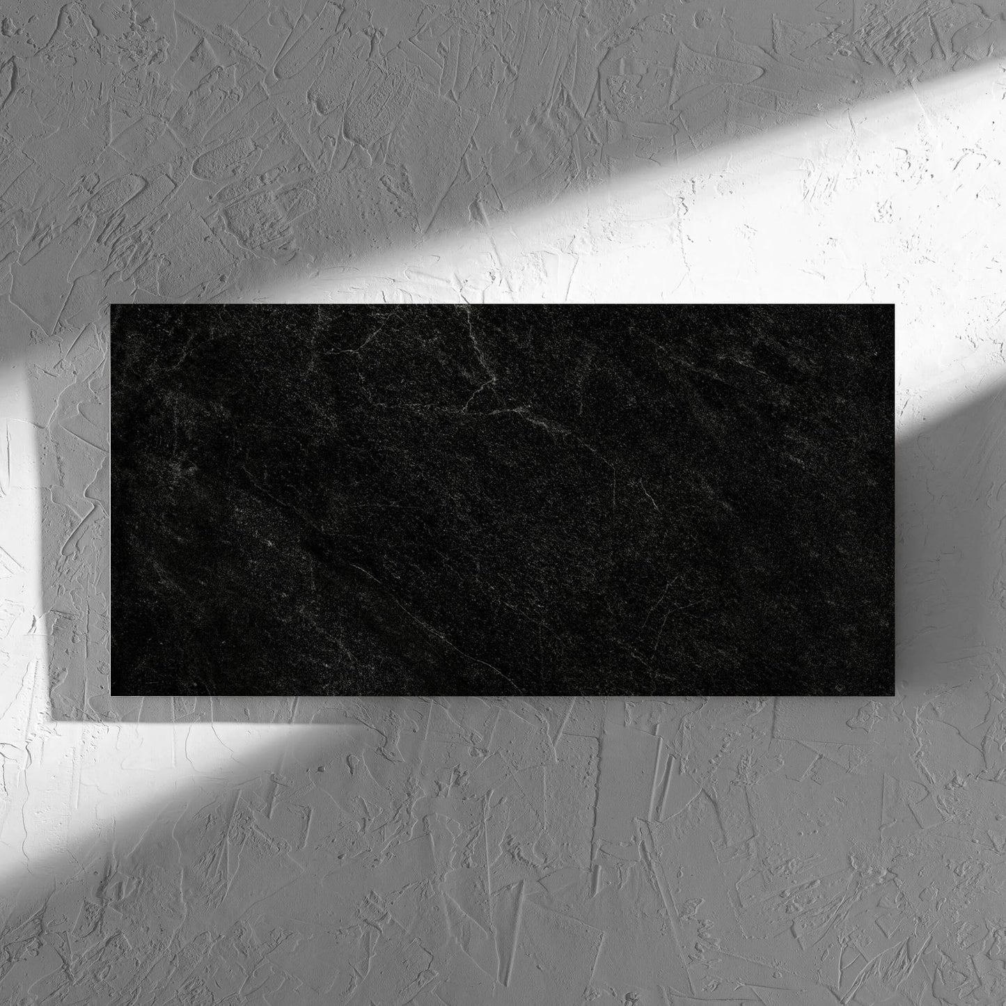 Lava Black Amber 300x600mm tile in soft natural window light, showing the lappato surface