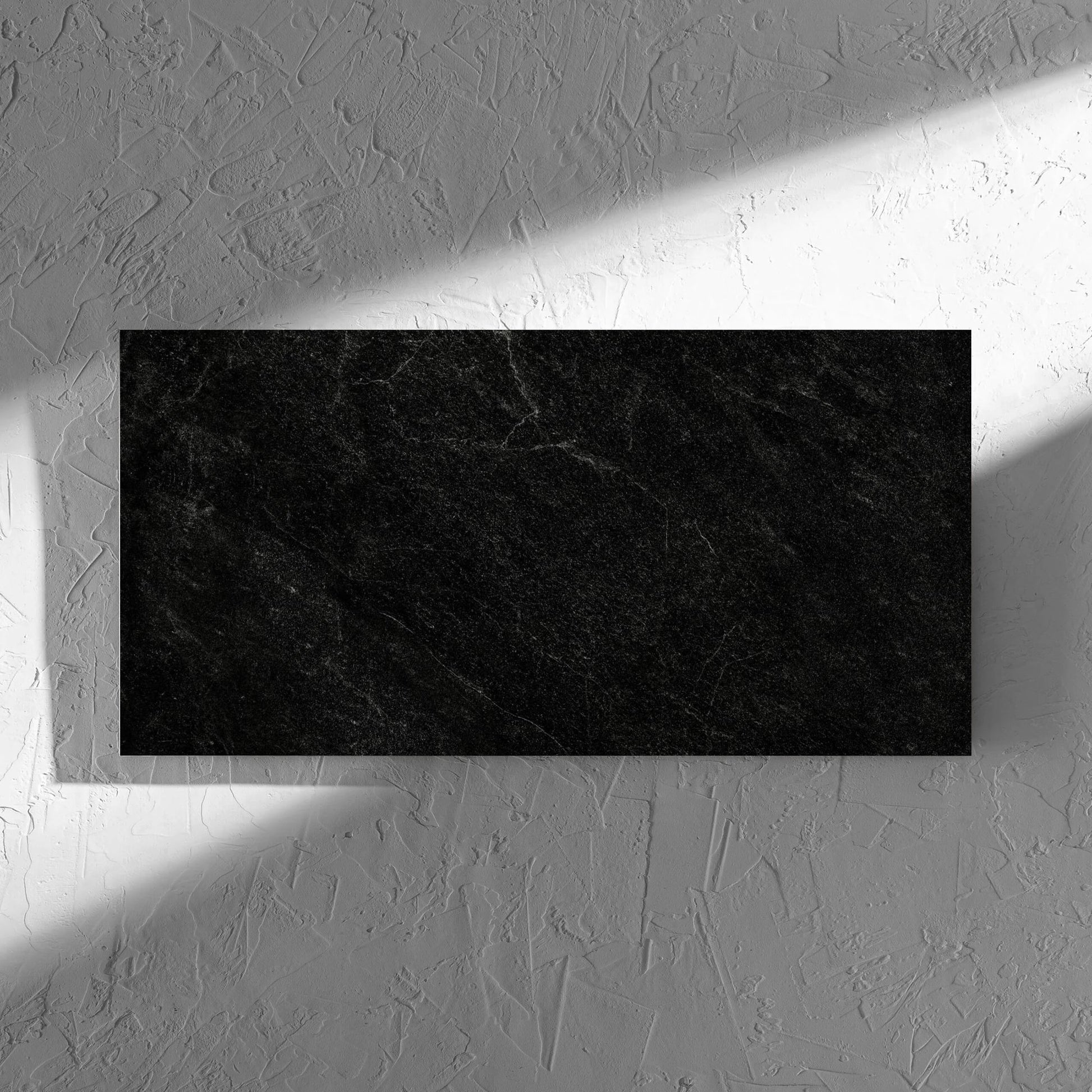 Lava Black Amber 300x600mm tile in soft natural window light, showing the lappato surface