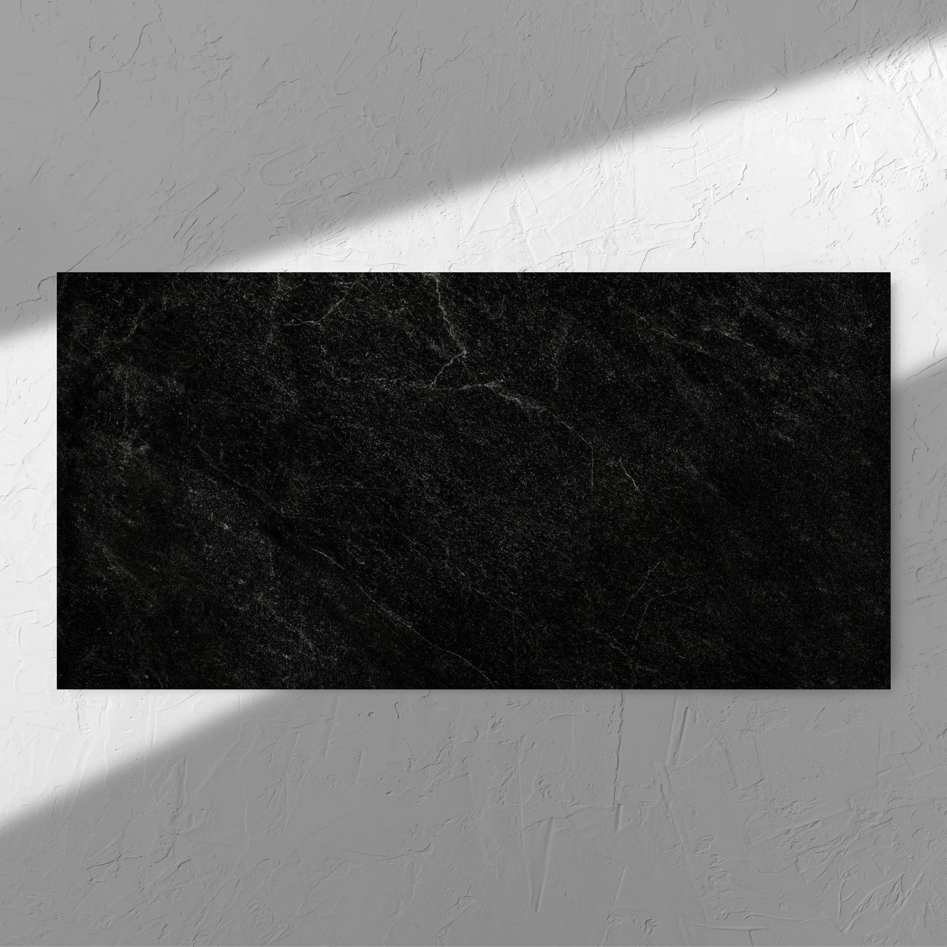 Lava Black Amber 600x1200mm tile in soft natural window light, showing the black surface