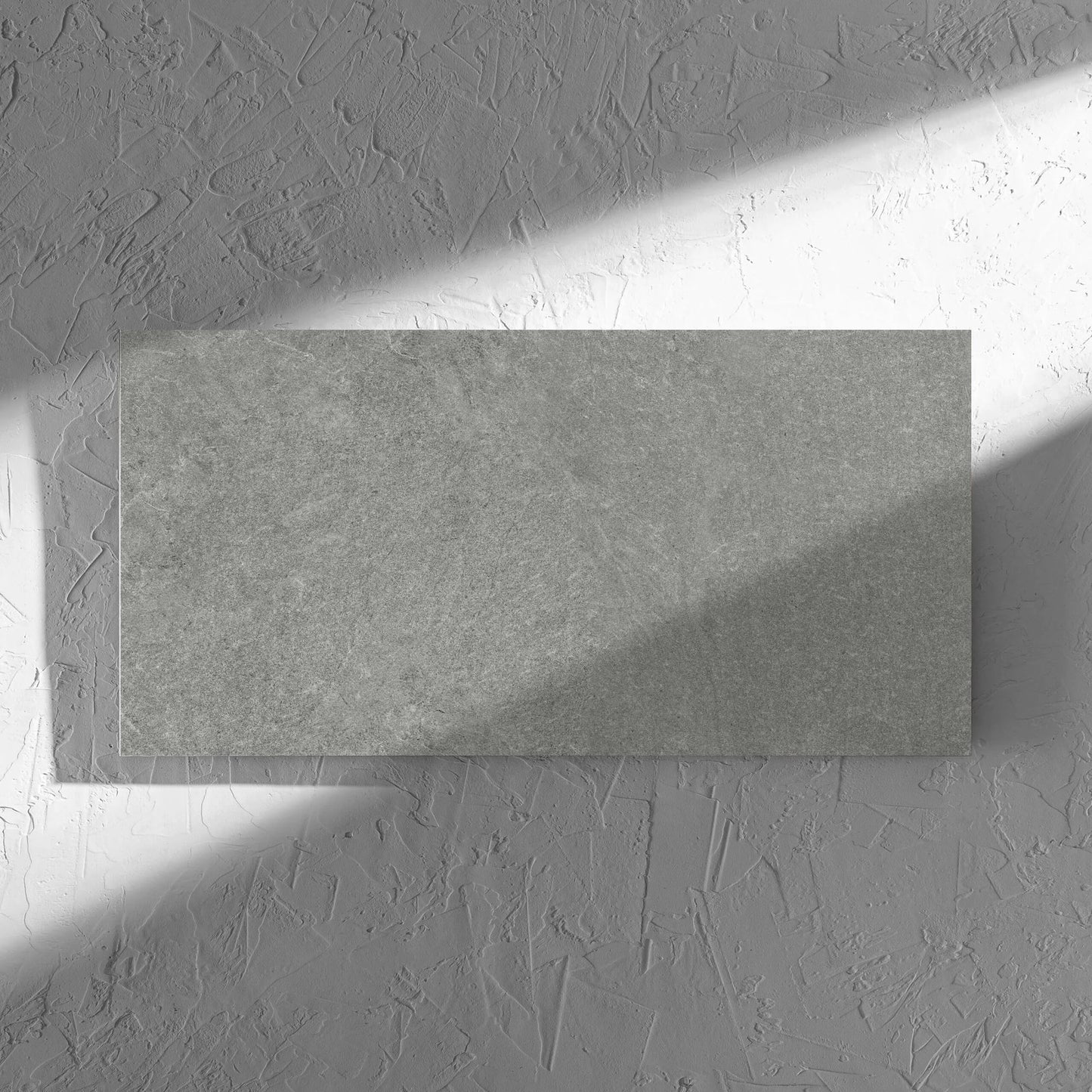 Lava Grey Amber 300x600mm tile in soft natural window light, showing the lappato surface