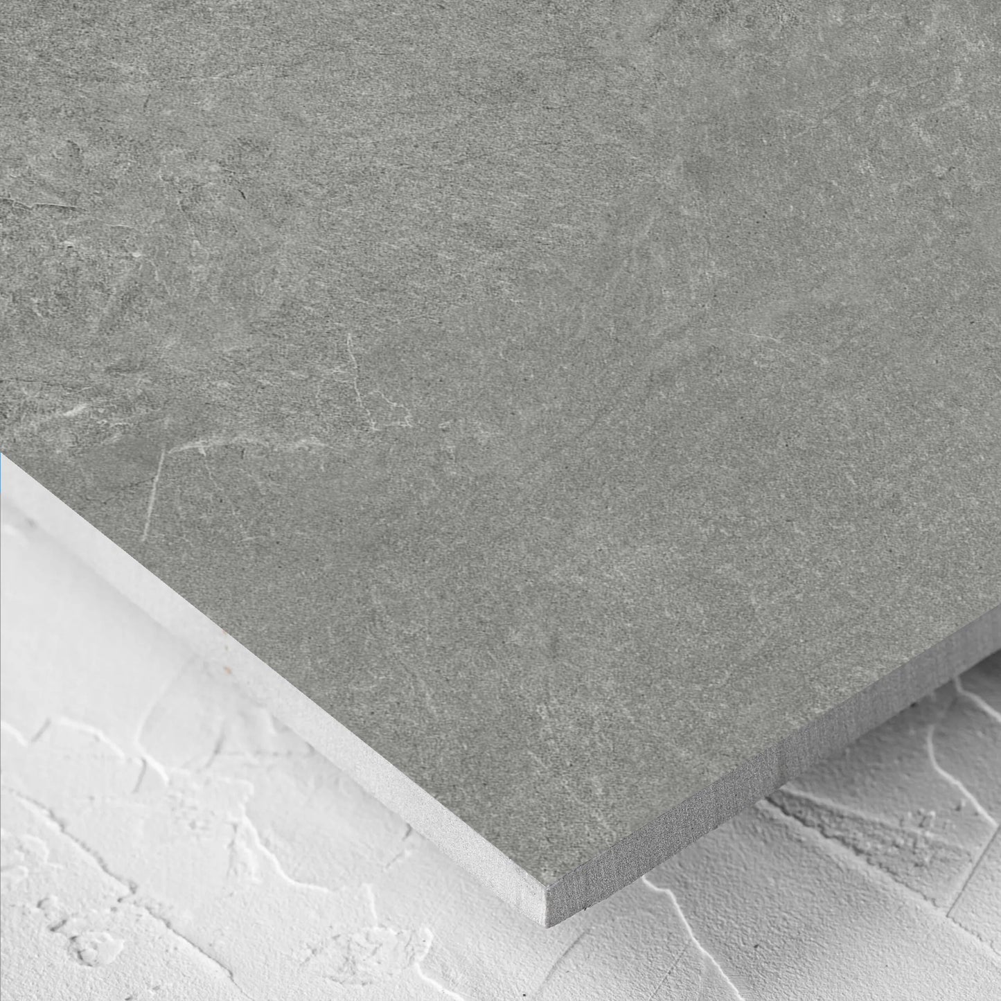Close-up of the Lava Grey Amber 600x1200mm tile showing the grey surface in detail