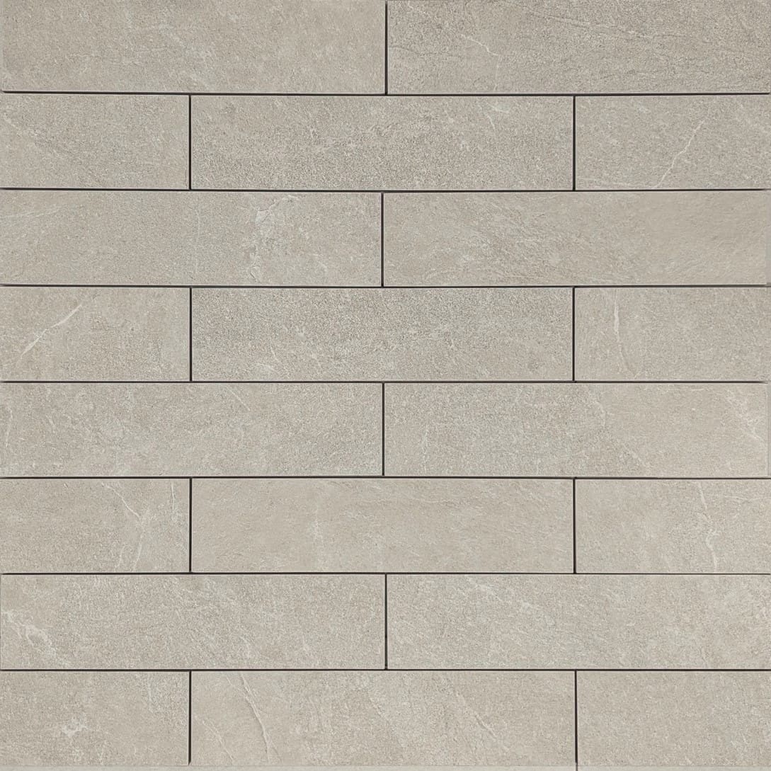Close-up texture shot of Lava Soft Beige Amber Brick/Subway 75x300mm tiles arranged in a staggered brick pattern with a matte stone-look finish.