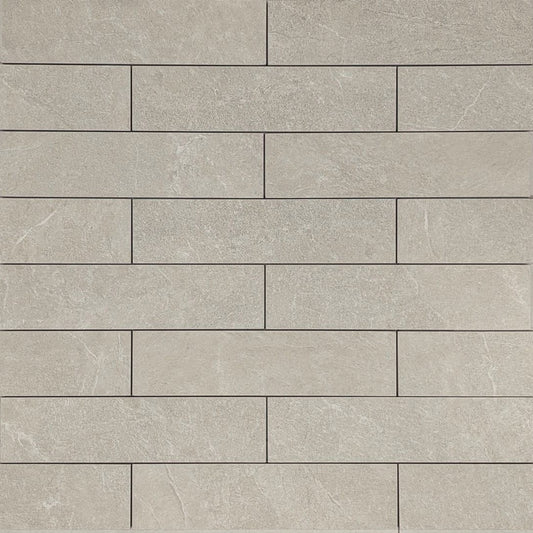 Close-up texture shot of Lava Soft Beige Amber Brick/Subway 75x300mm tiles arranged in a staggered brick pattern with a matte stone-look finish.