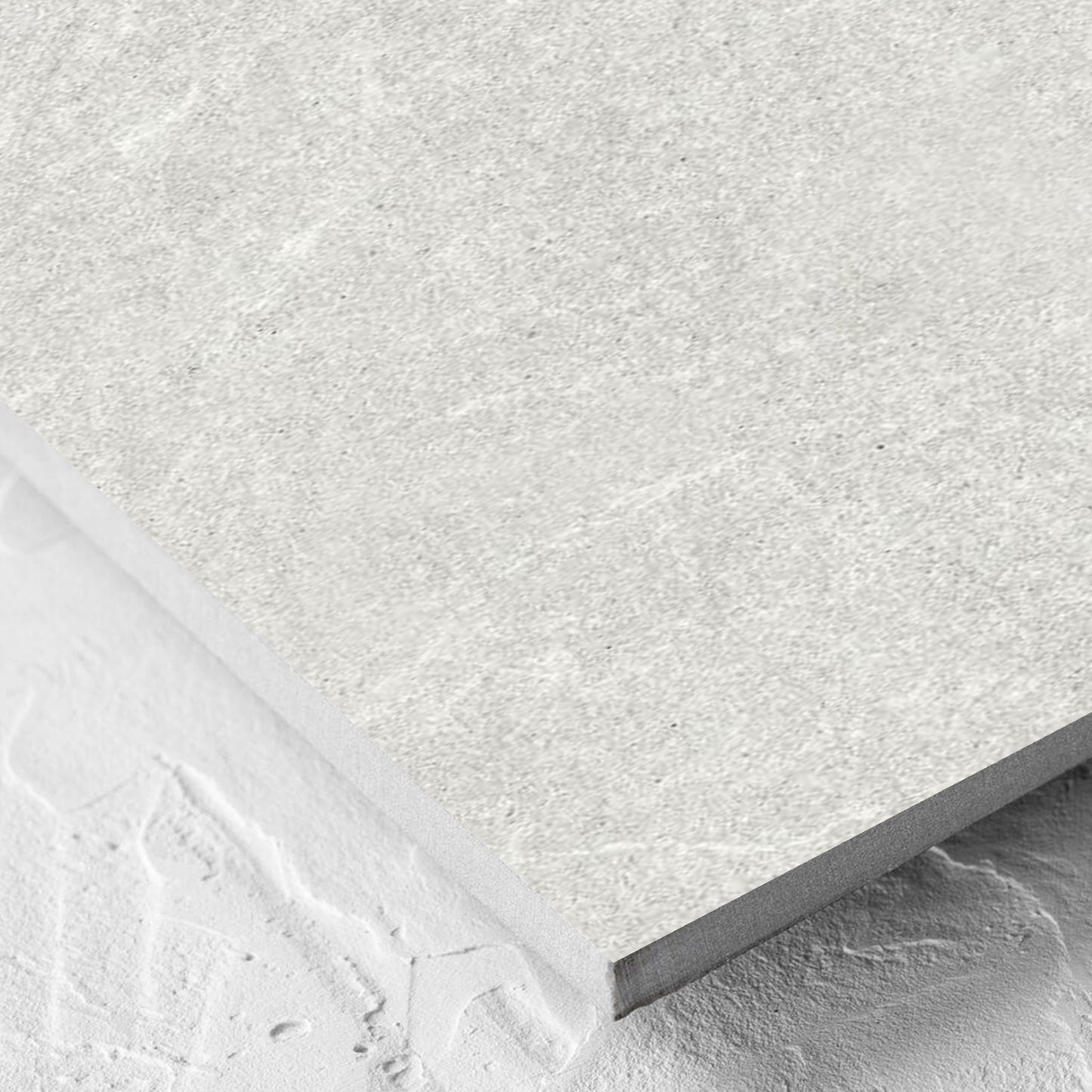 Corner close-up of the Lava Warm Grey Amber 300x600mm tile showing the lappato surface and the edge profile