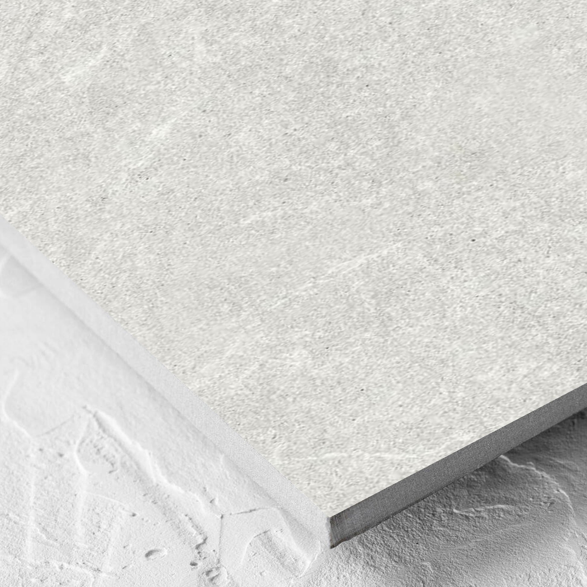Corner close-up of the Lava Warm Grey Amber 300x600mm tile showing the lappato surface and the edge profile