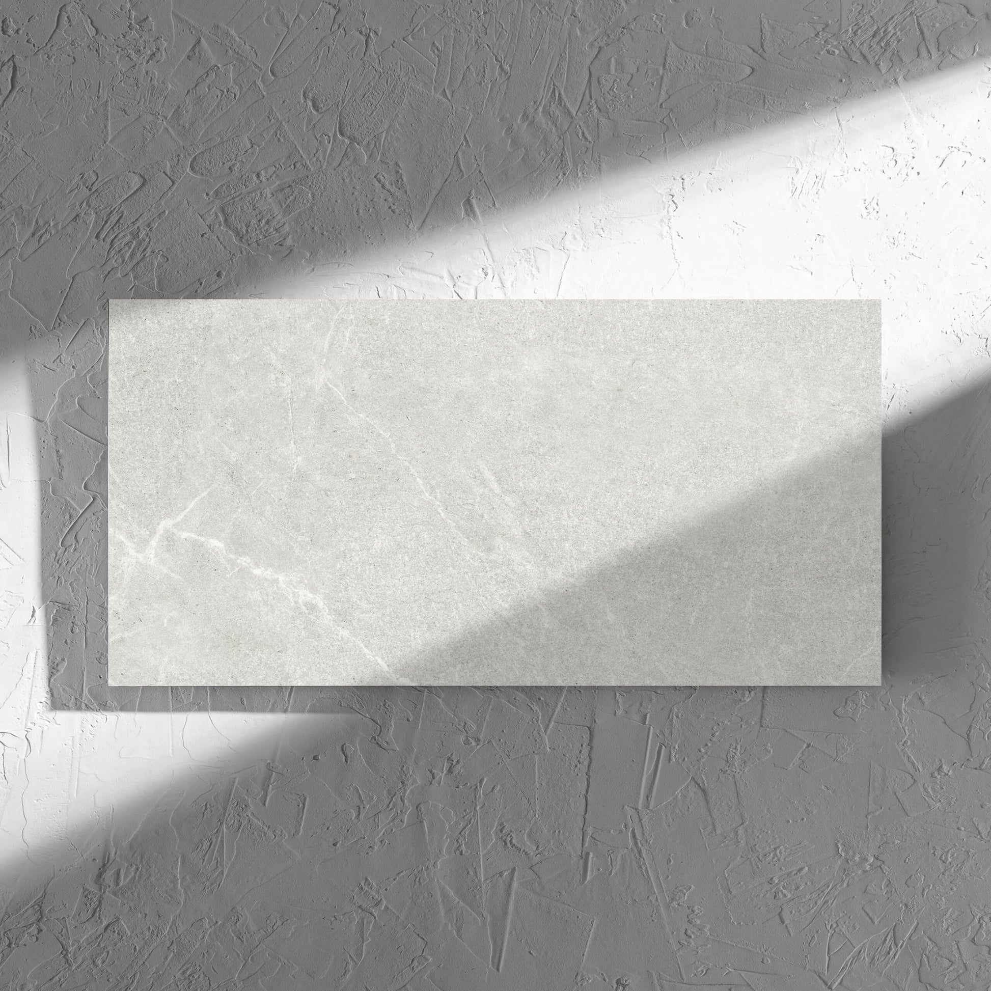 Lava Warm Grey Amber 300x600mm tile in soft natural window light, showing the lappato surface