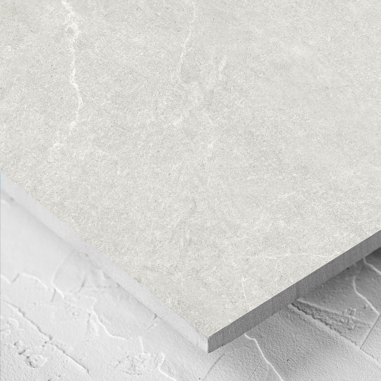 Close-up of the Lava Warm Grey Amber 600x1200mm tile showing the warm grey surface in detail