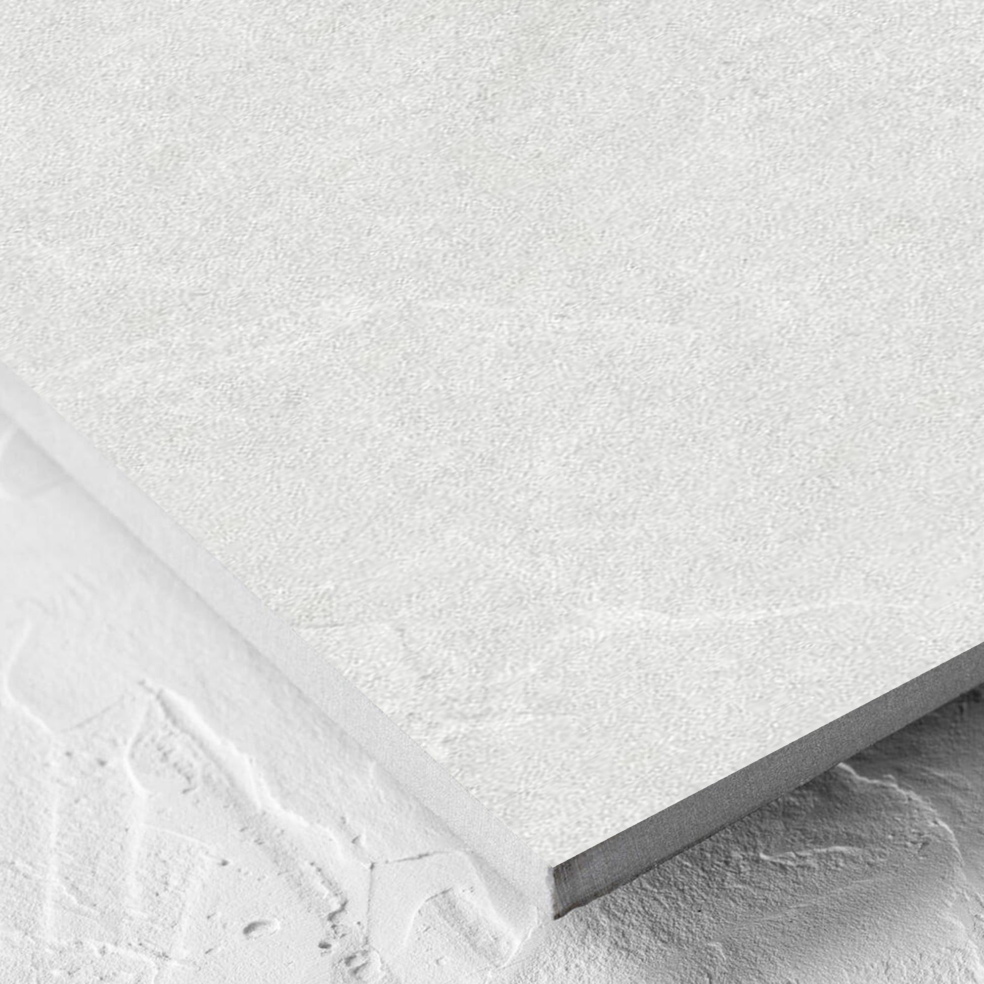 Corner close-up of the Lava White Amber 300x600mm tile showing the tile surface and the edge profile