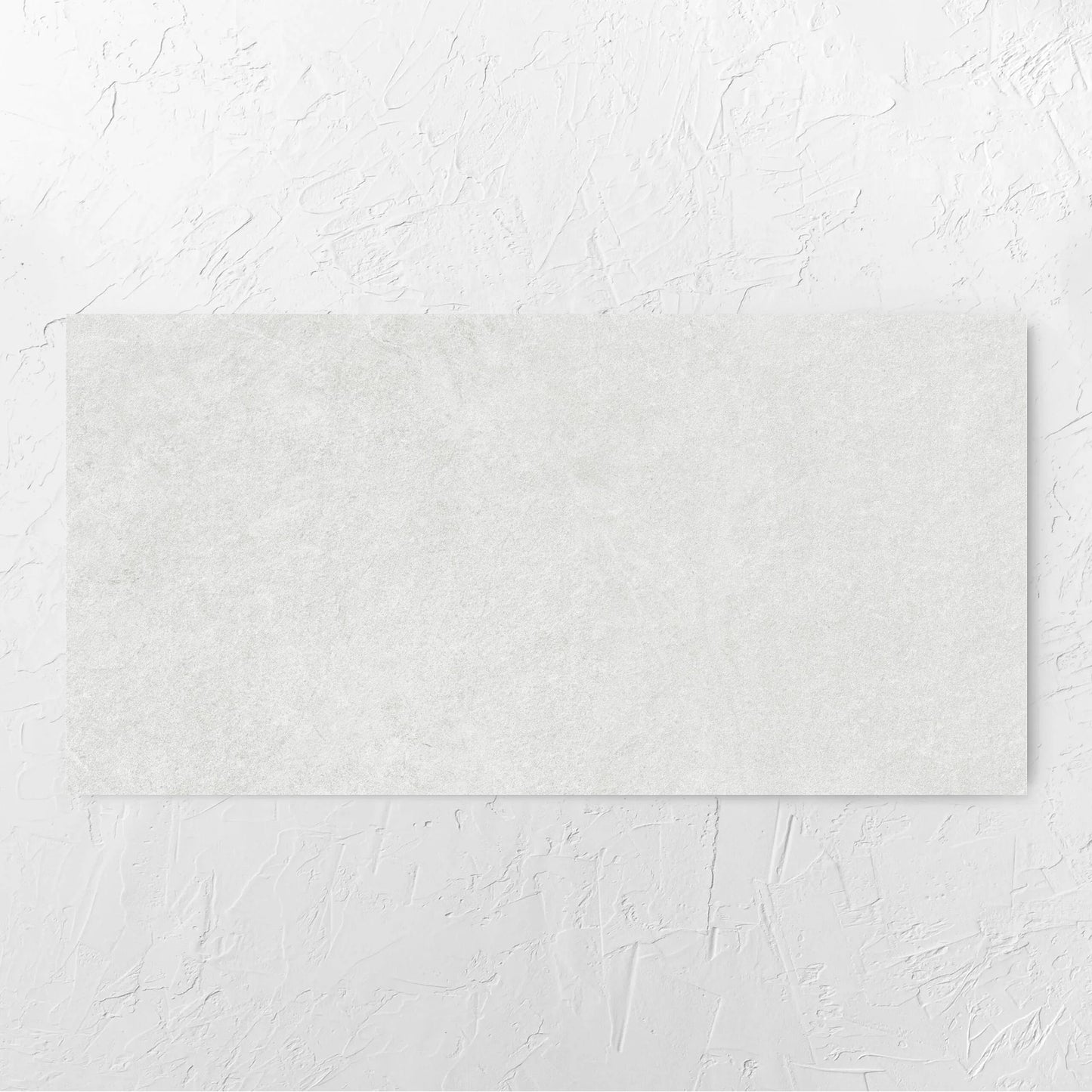 Lava White Amber 600x1200mm tile laid flat on a white rendered wall, showing the tile surface