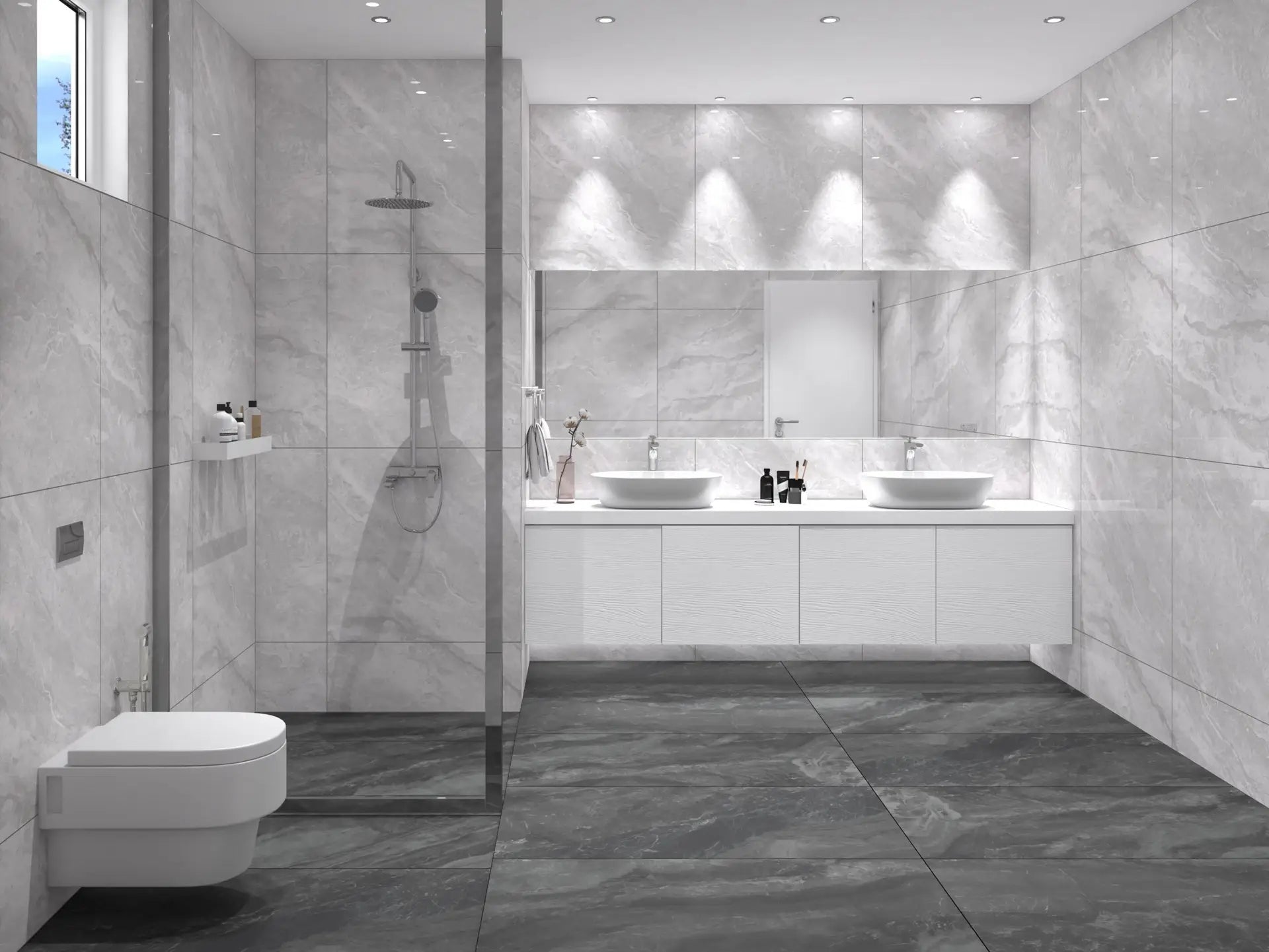 Legacy Silver Ash Rectified 600x1200mm tiles covering floor-to-ceiling bathroom walls alongside a floating double vanity, walk-in shower, and wall-hung toilet.