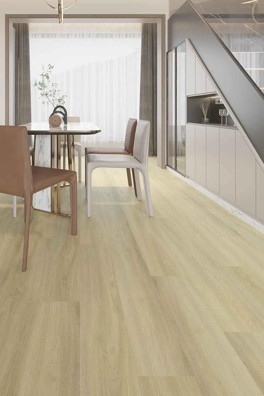 Lime Ash Elegant SPC Hybrid 9.5mm Flooring 7.5+2mm installed in a modern dining room featuring a marble table, tan leather chairs, and under-stair storage cabinetry.