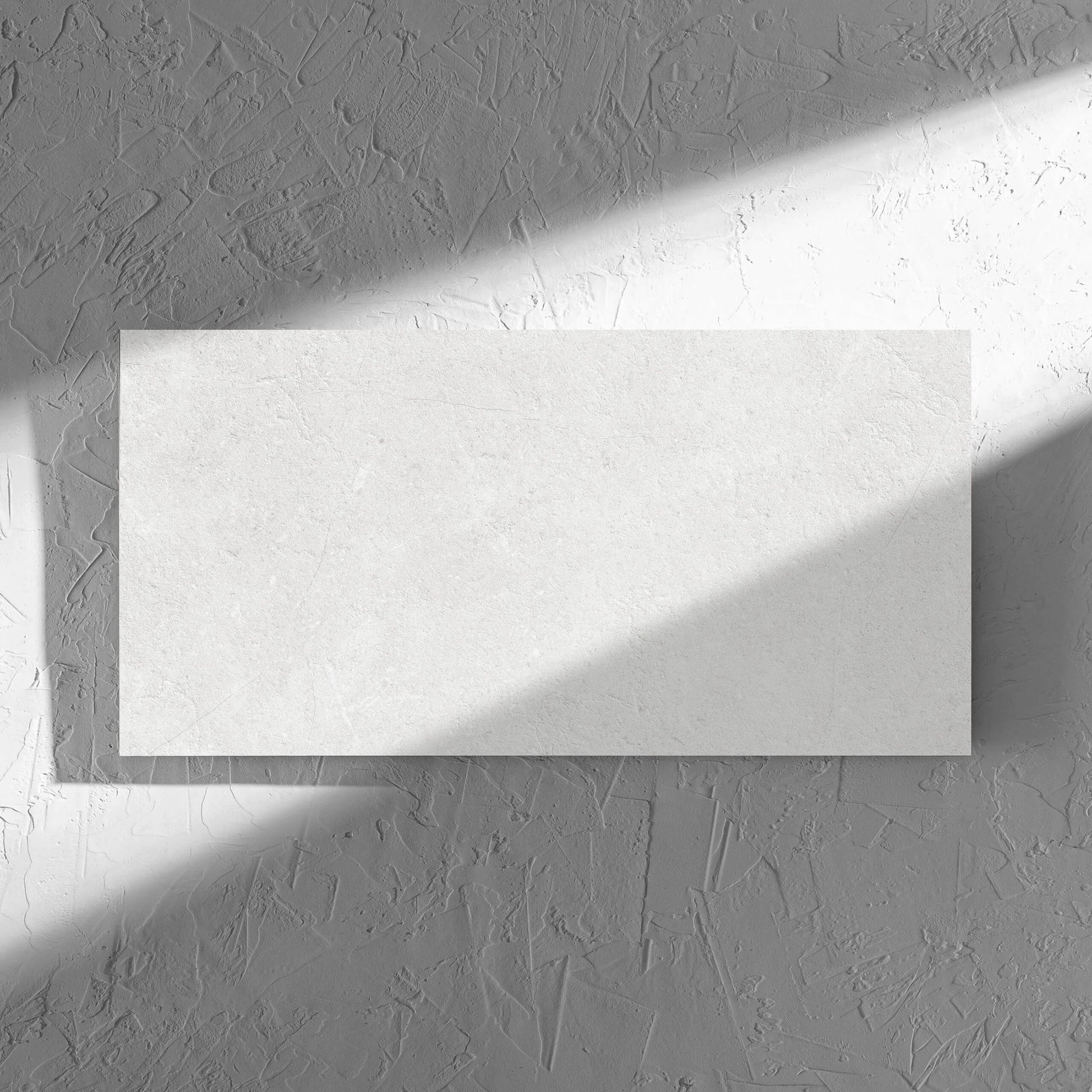 Lusso Bianco Amber 300x600mm tile in soft natural window light, showing the matt surface