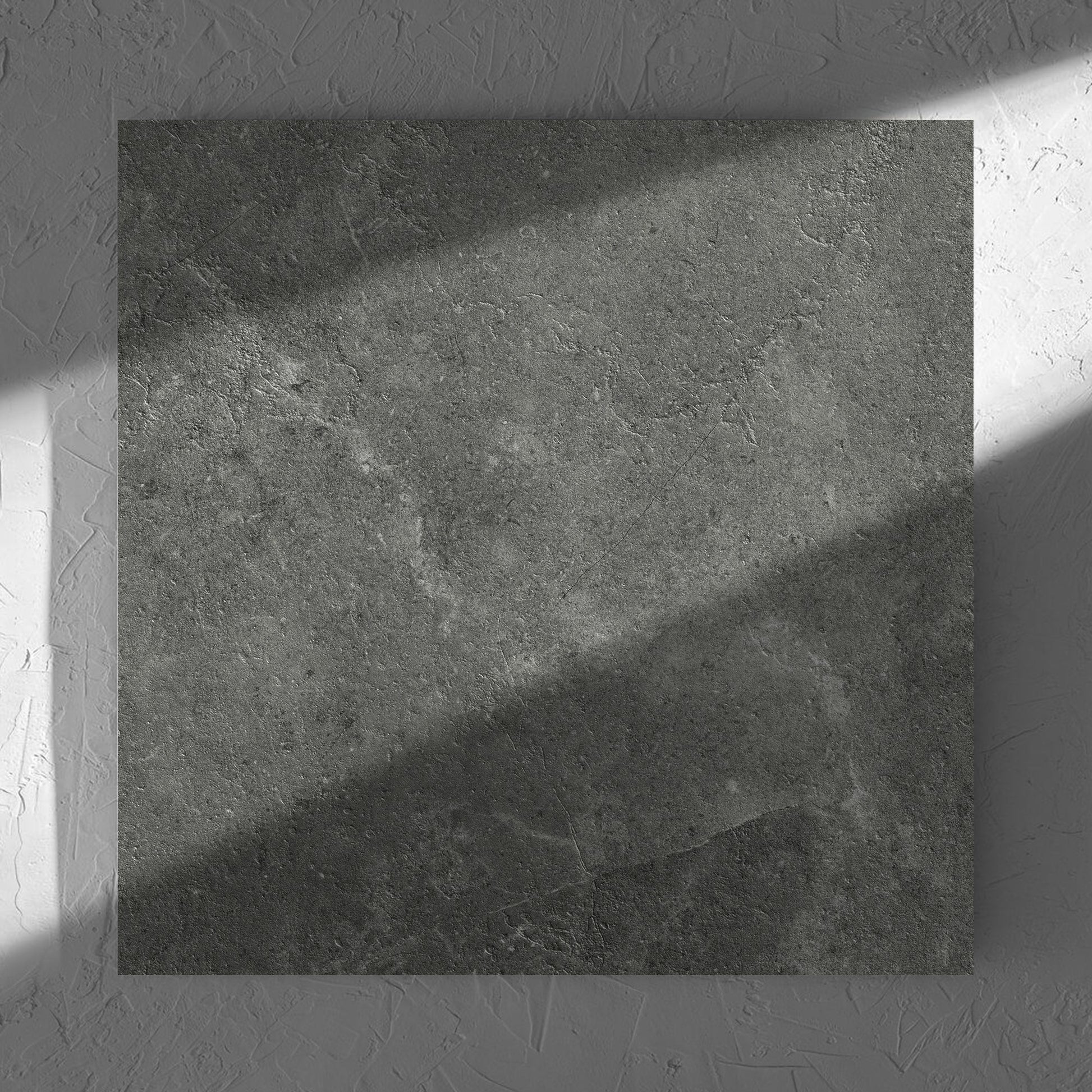 Lusso Midnight Amber 600x600mm tile in soft natural window light, showing the matt surface