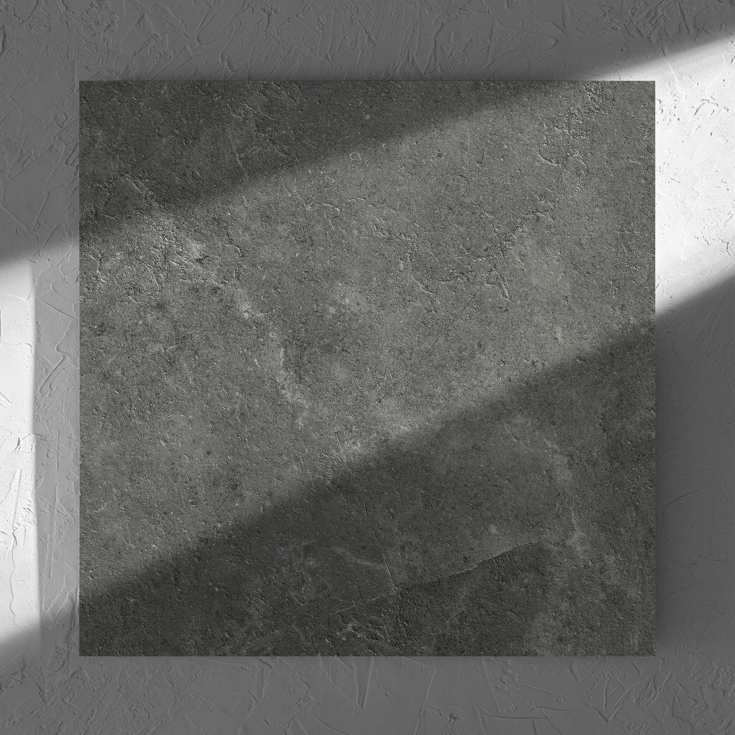 Lusso Midnight Matt 600x600mm tile in soft natural window light, showing the matt surface