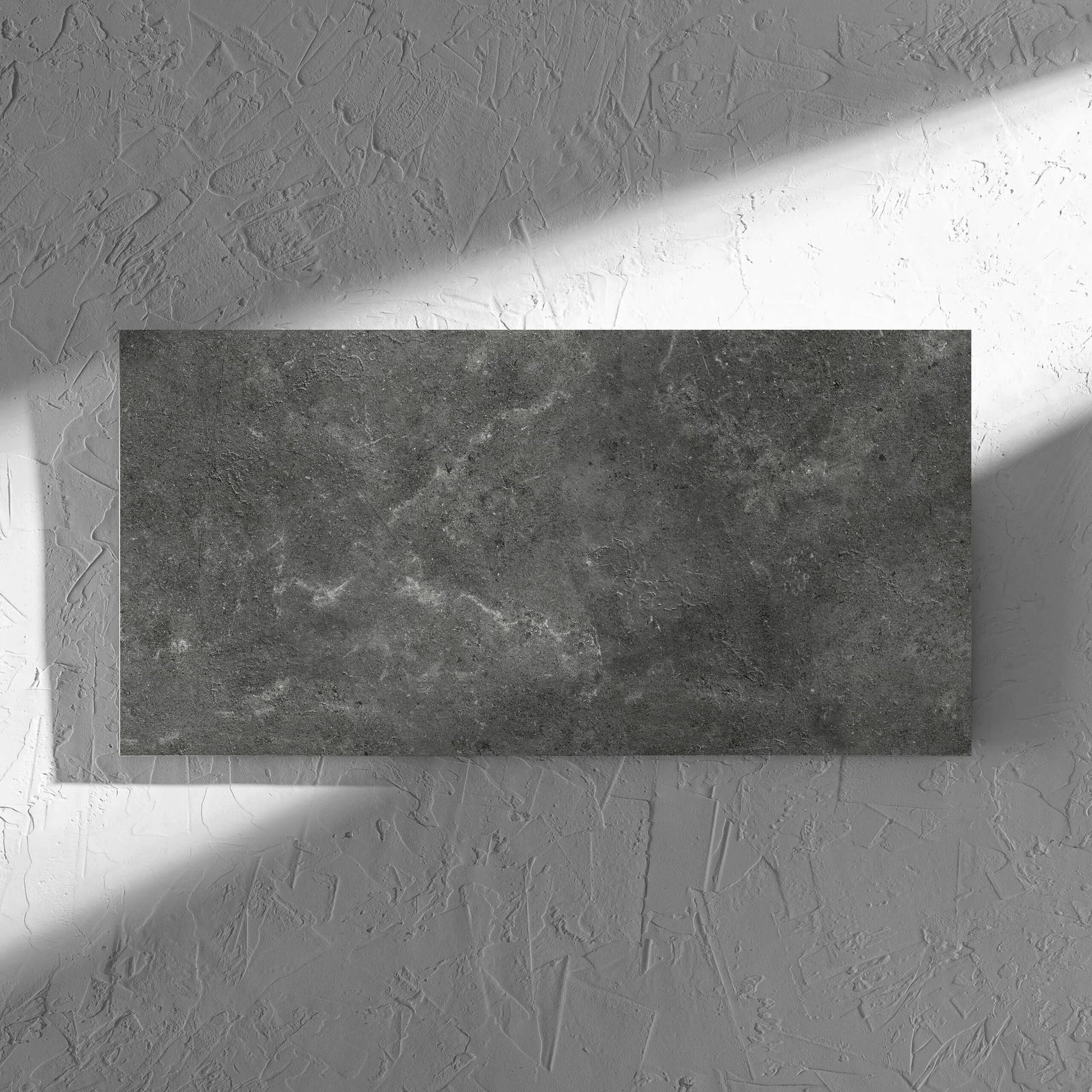 Lusso Nero Amber 300x600mm tile in soft natural window light, showing the matt surface