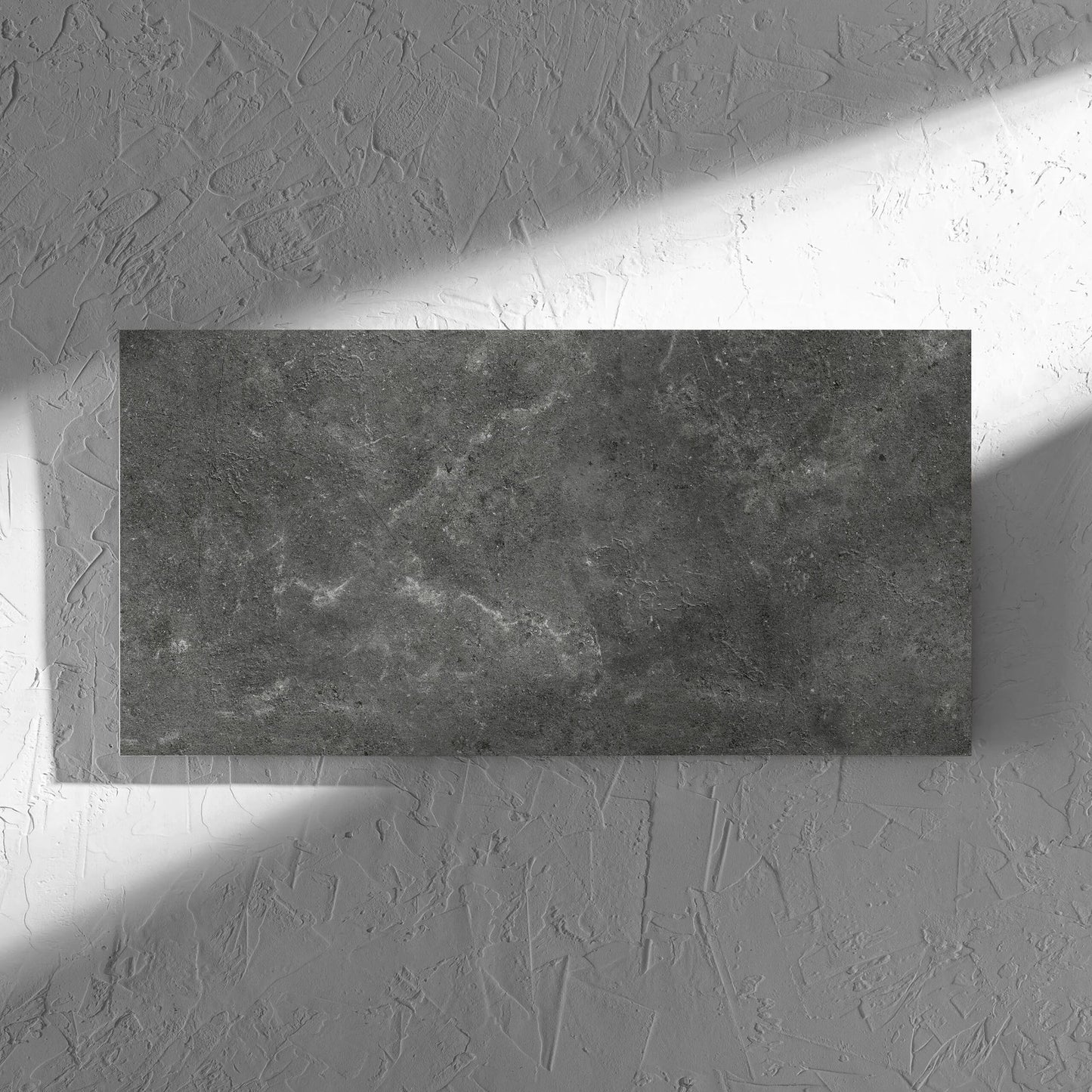 Lusso Nero Matt 300x600mm tile in soft natural window light, showing the matt surface