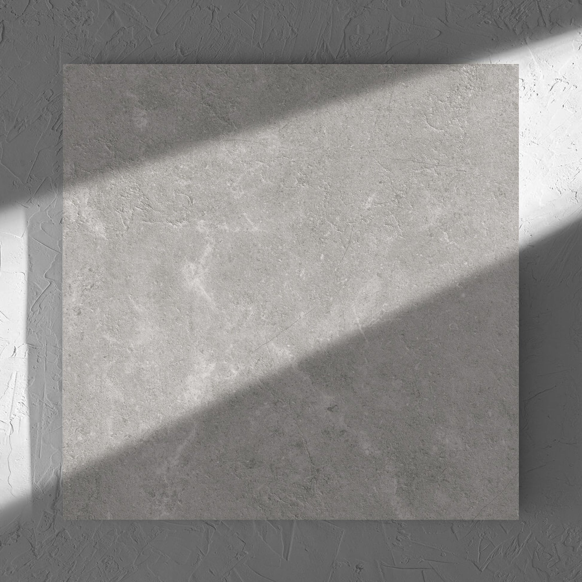 Lusso Terra Amber 600x600mm tile in soft natural window light, showing the matt surface