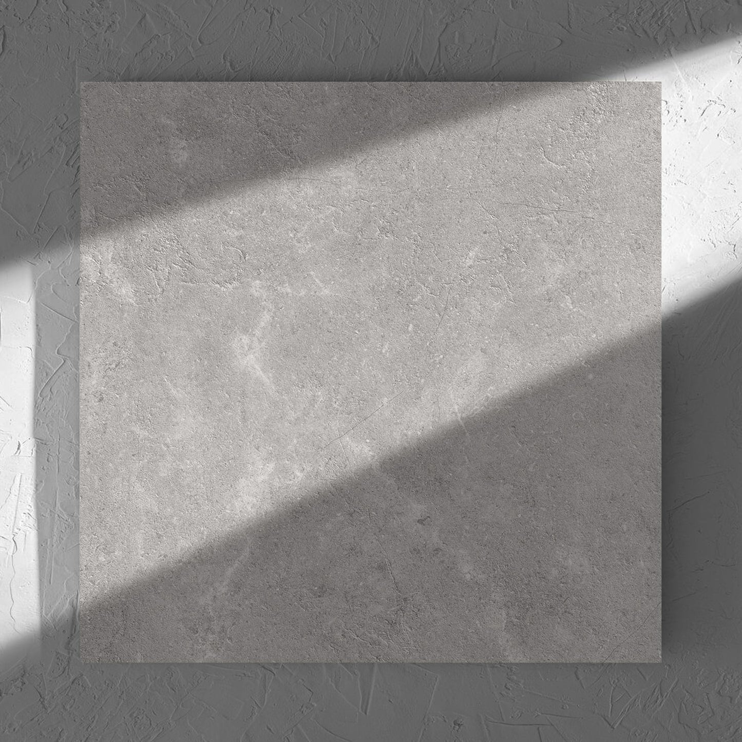 Lusso Terra Matt 600x600mm tile in soft natural window light, showing the matt surface
