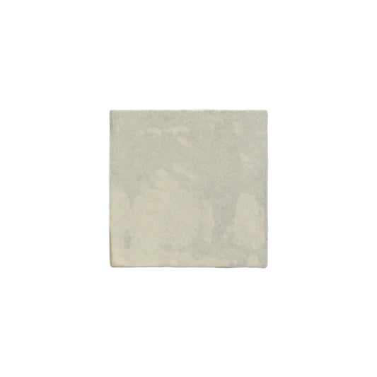 Single square Majorca Gloss Cement 100x100mm wall tile featuring a soft grey-white gloss finish with subtle handmade surface variation.