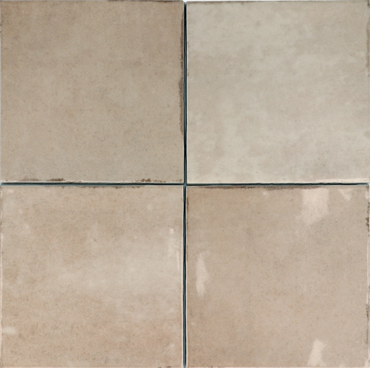 Four Majorca Gloss Taupe 100x100mm ceramic wall tiles arranged in a grid, showing subtle tonal variation and a warm beige gloss finish.