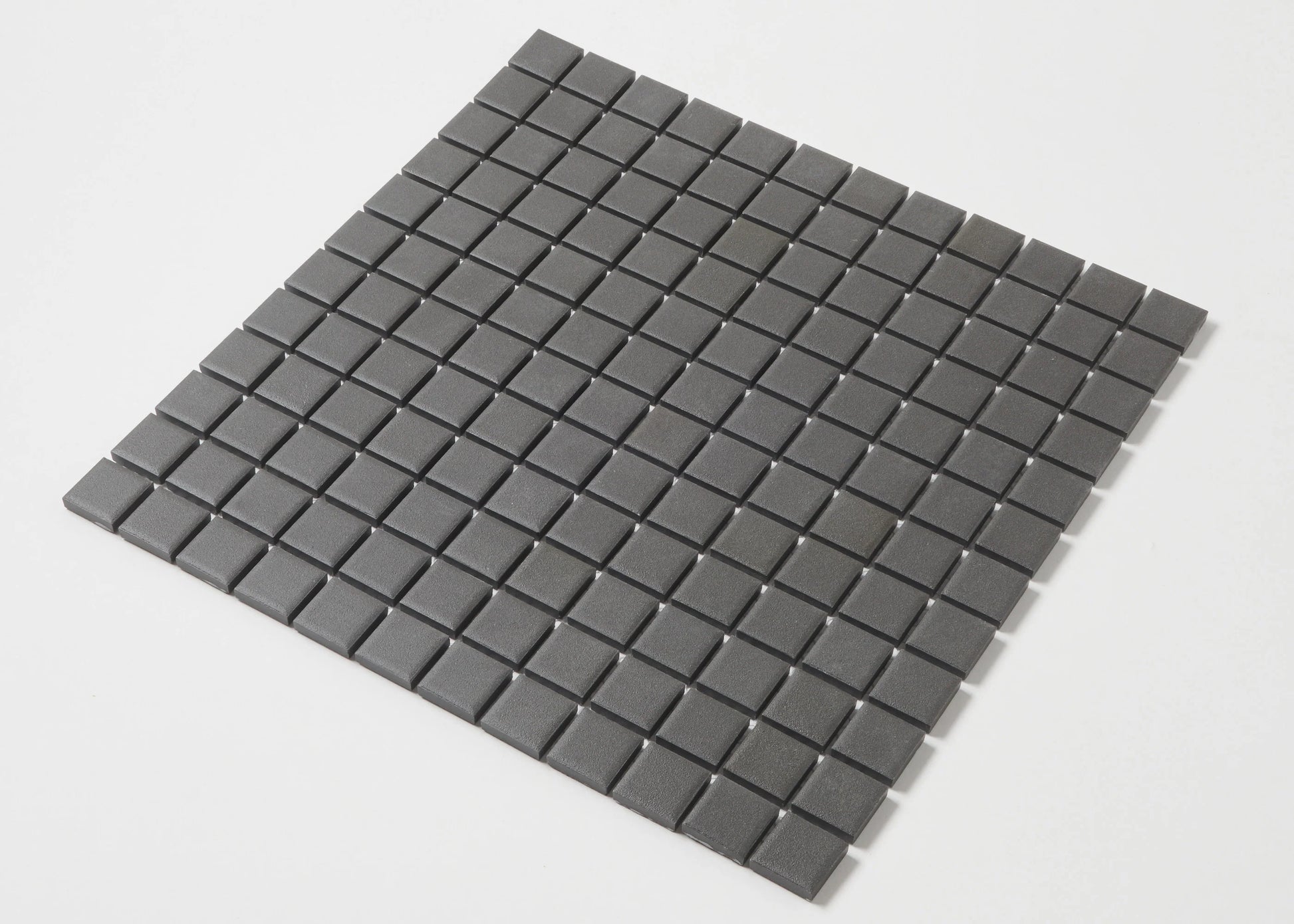 Marlowe Black Matt Mosaic 23x23mm tile sheet shown as a flat lay pack shot, featuring uniform dark grey square mosaic tiles with a matte finish and fine grout lines.