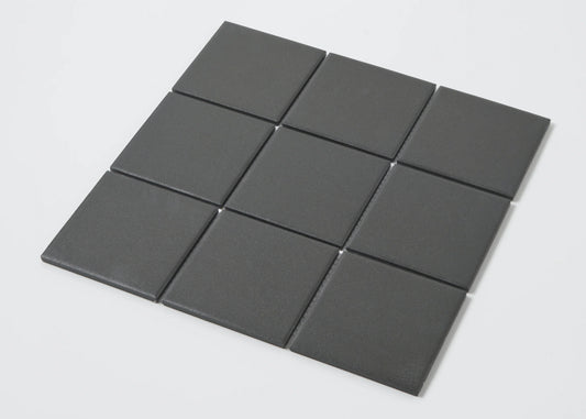 Pack shot of Marlowe Black Matt Mosaic 97x97mm tiles arranged in a 3x3 grid, showing a smooth matte charcoal grey square format finish.