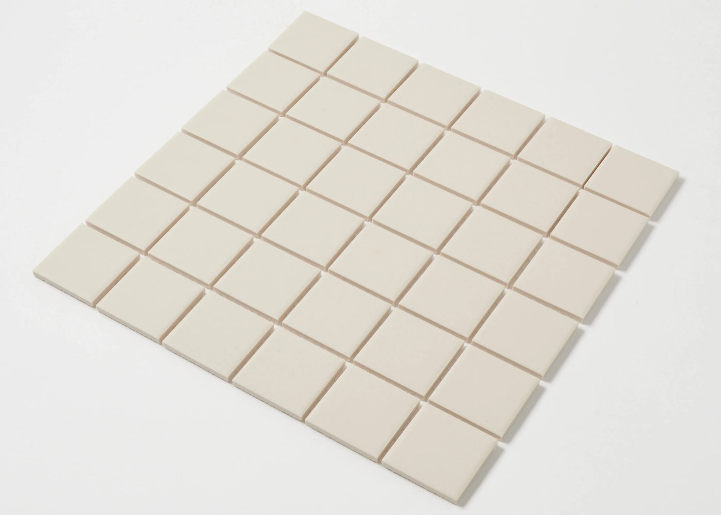 Marlowe Bone Matt Mosaic 48x48mm shown as a flat lay grid of uniform cream-toned square tiles with a smooth matte finish.