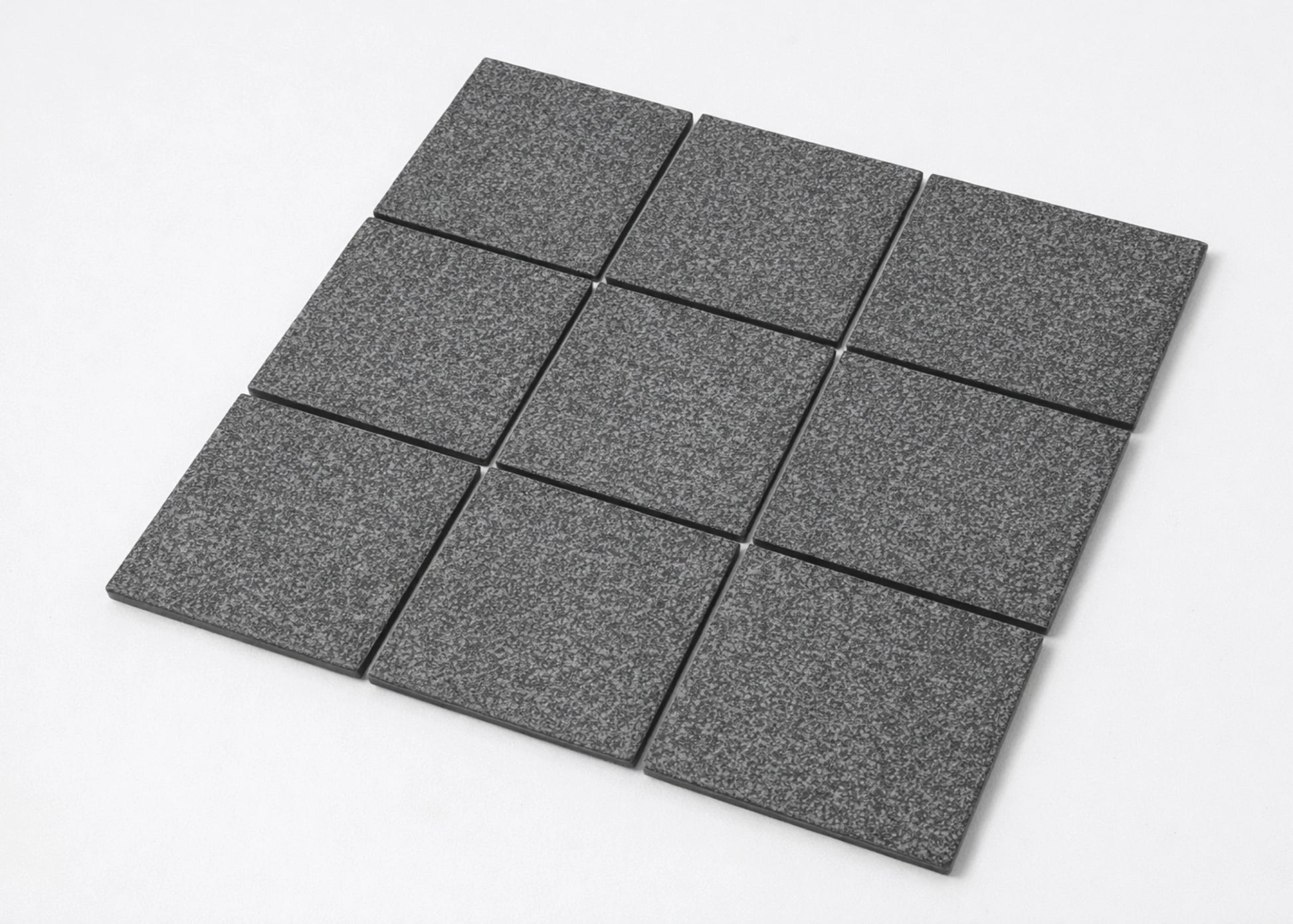 Pack shot of Marlowe Charcoal Speckled Matt Mosaic 97x97mm tiles arranged in a 3x3 grid, showing the dark grey speckled matt surface finish and square format.