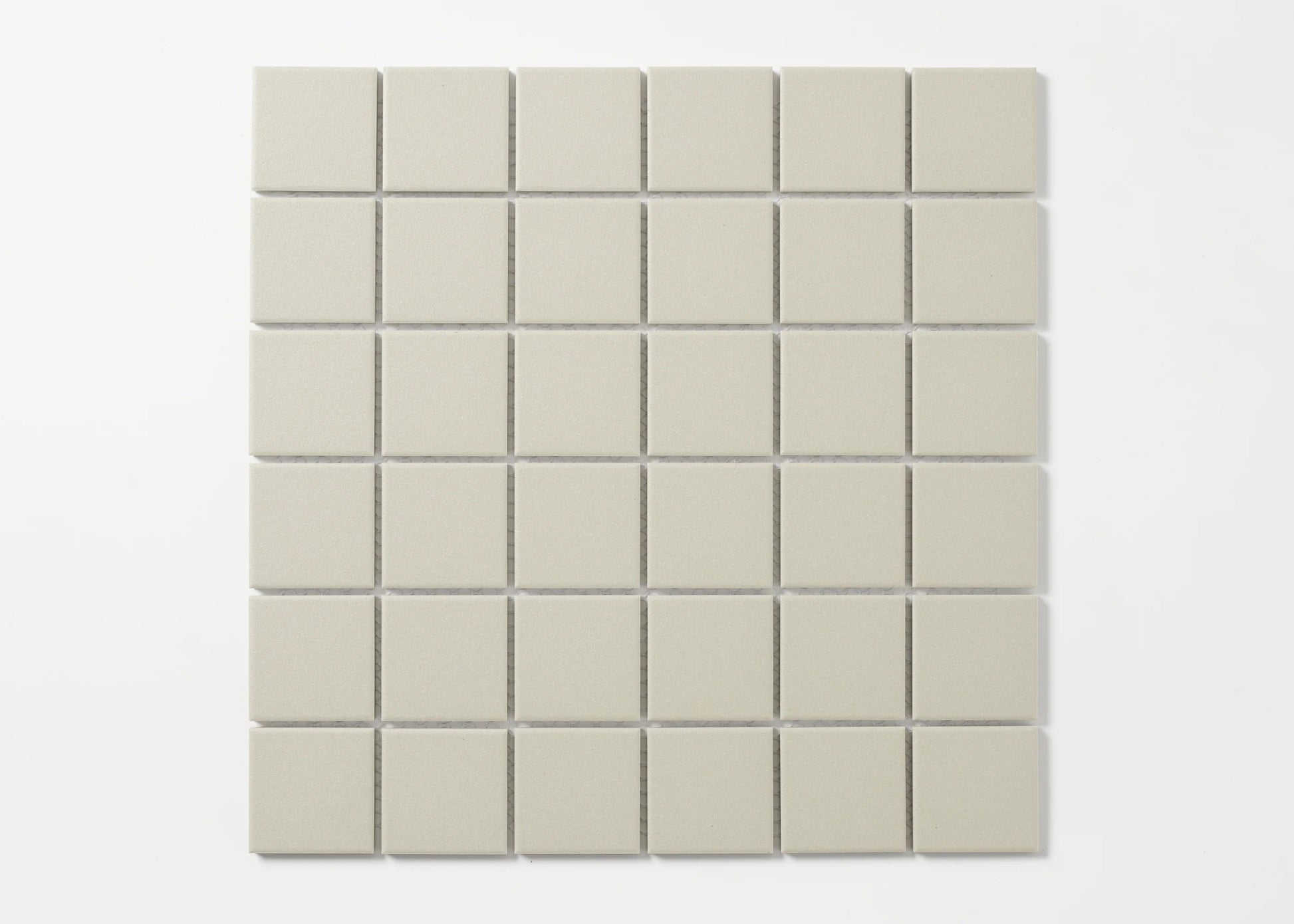 Pack shot of Marlowe Light Grey Matt Mosaic 48x48mm tiles arranged in a uniform 6x6 grid, showing a soft matte finish and consistent light grey colour.