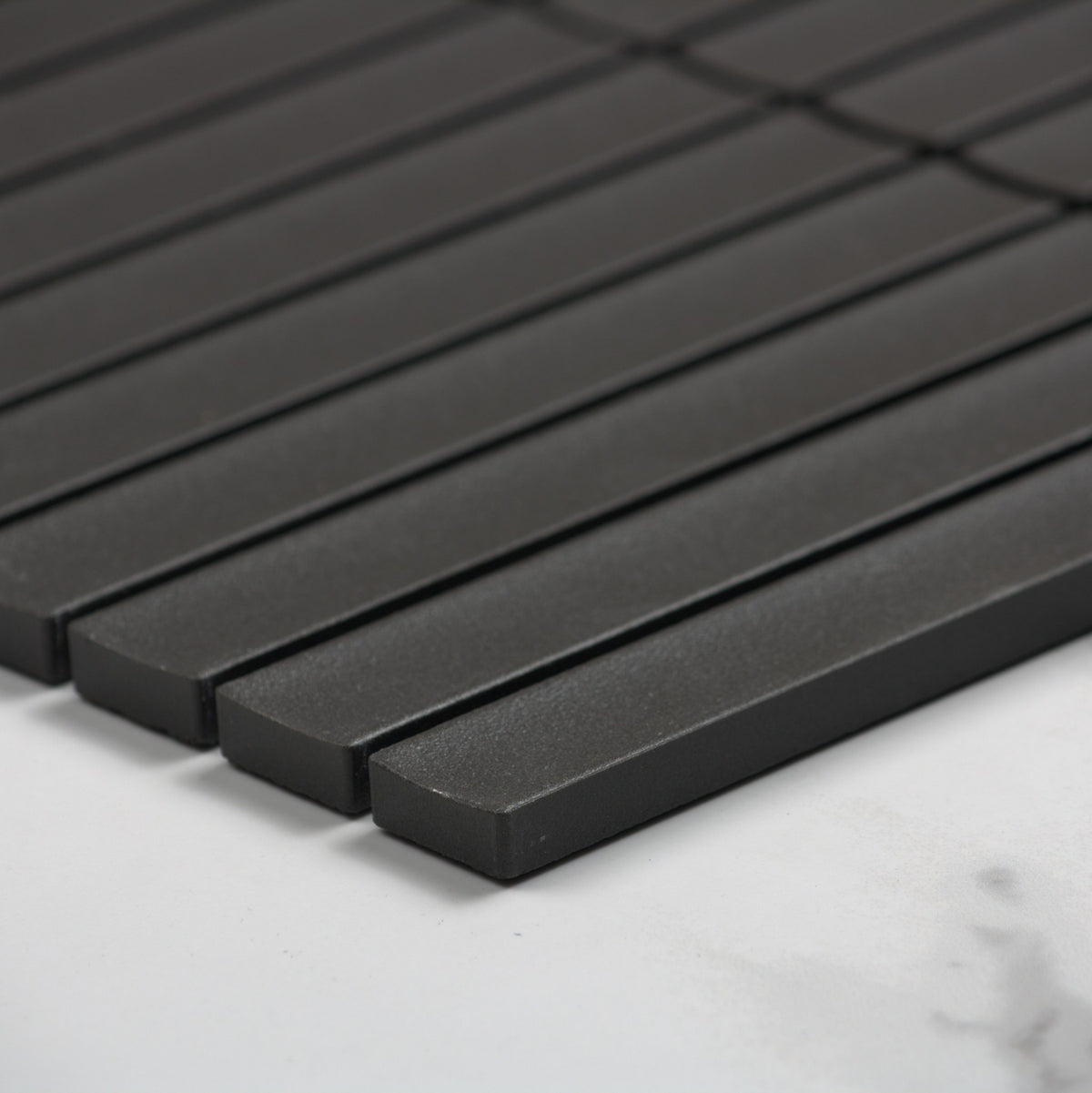Marlowe Onyx Concave Speckled Matt Rectangle 20x145mm angle view