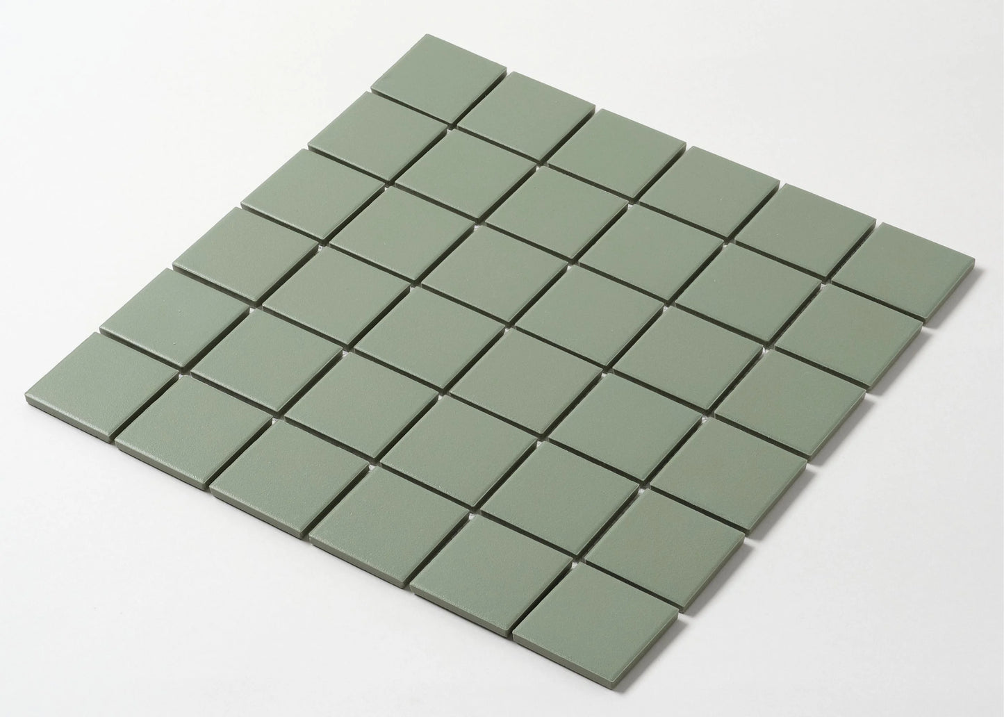 Pack shot of Marlowe Pistachio Green Matt Mosaic 48x48mm tiles arranged in a 7x7 grid, showing the soft sage green matte finish and square format.