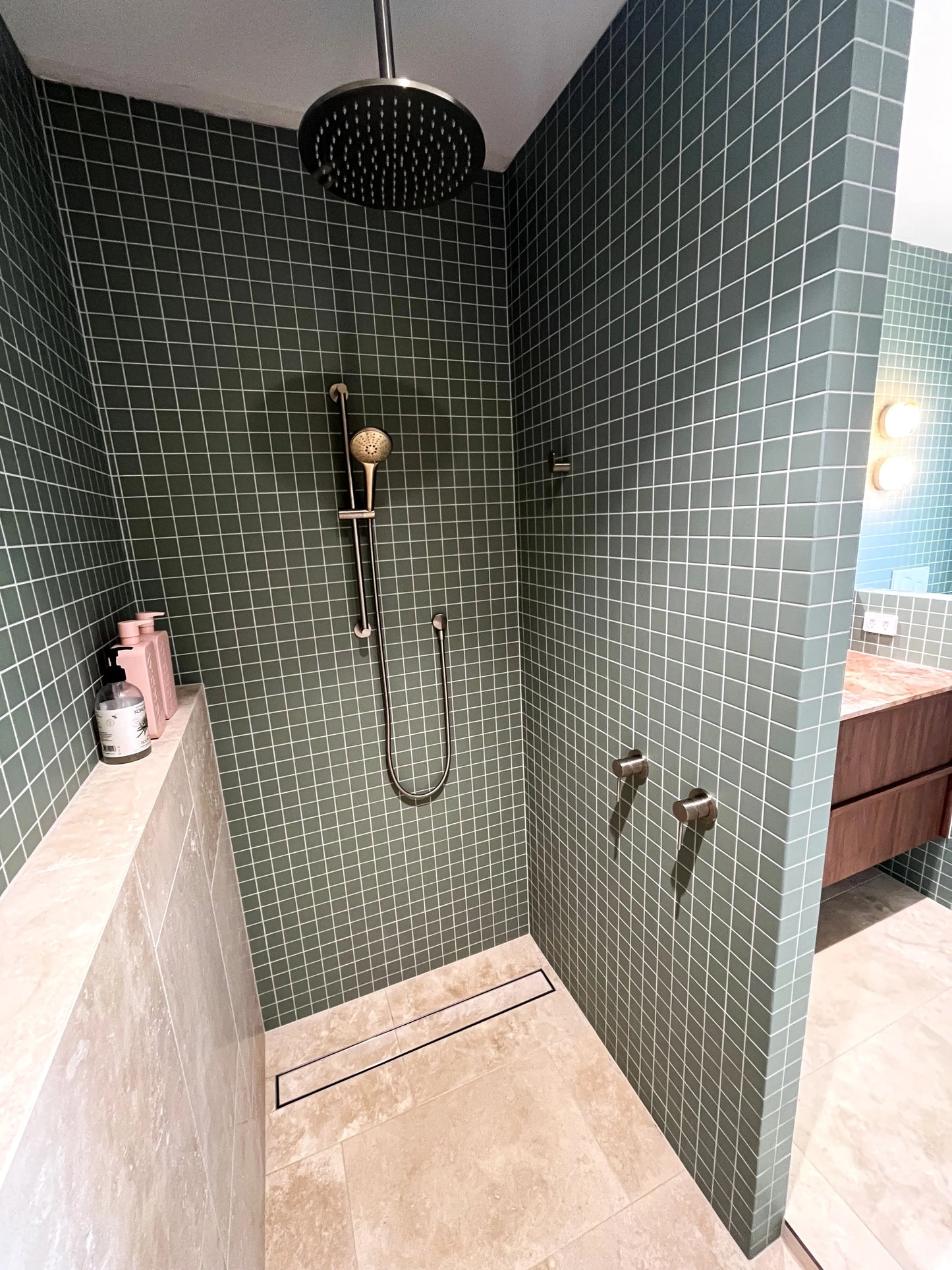 Marlowe Pistachio Green Matt Mosiac 48x48mm tiles covering the walls of a modern walk-in shower with rain head, handheld shower rail, and linear drain.